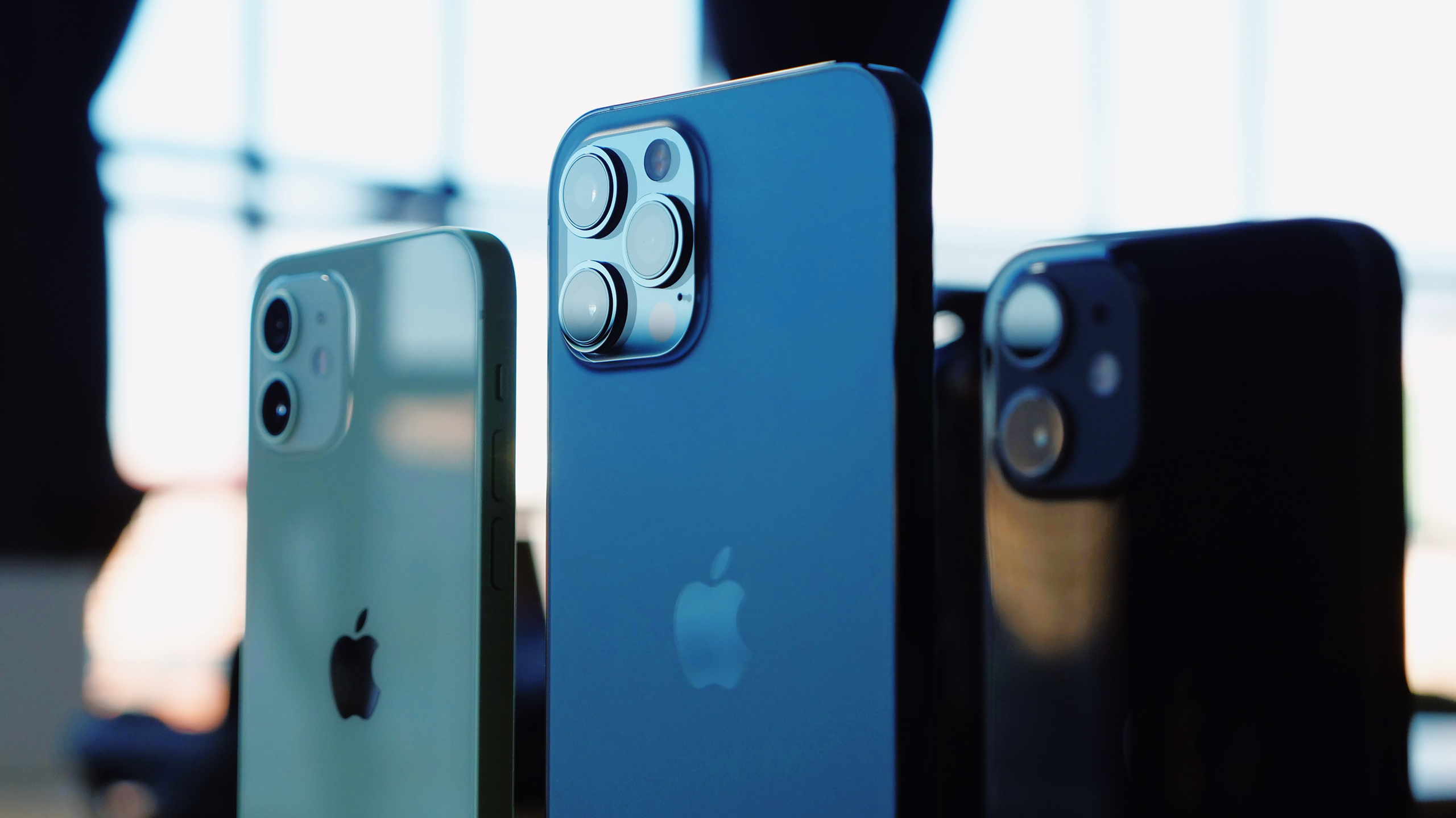Close-up photo of three iPhones