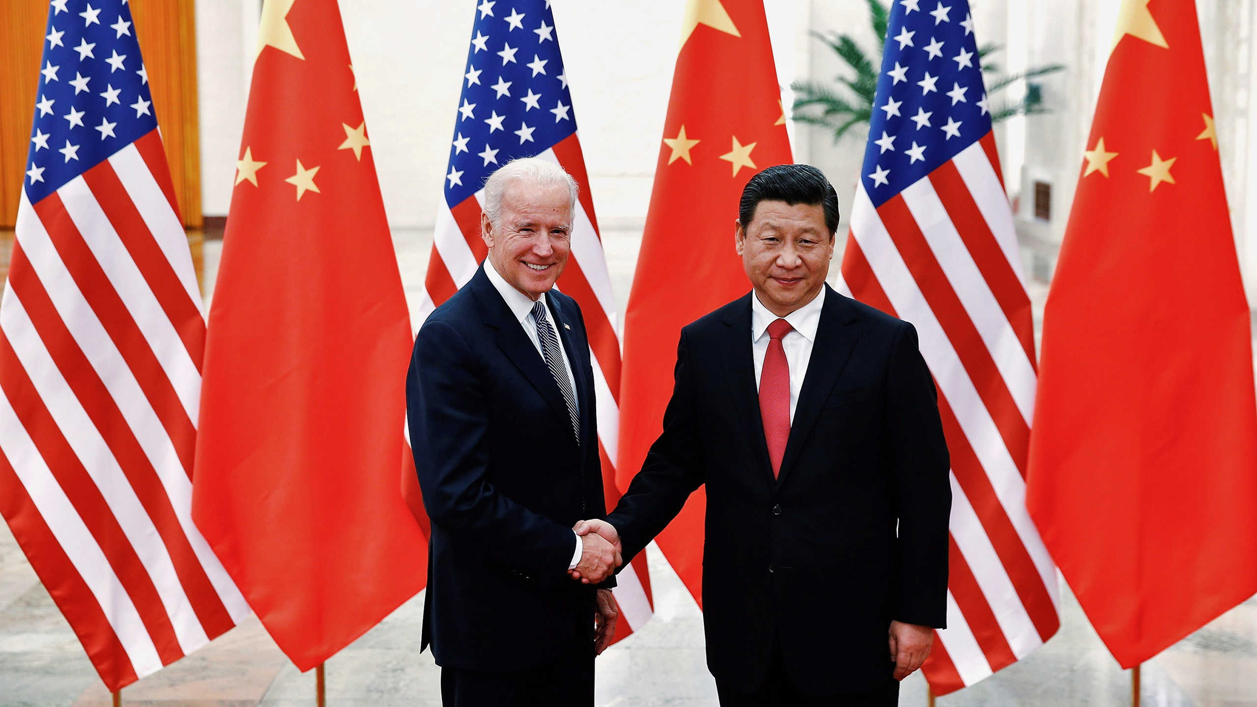 Photo of President Joe Biden and President Xi Jinping shaking hands