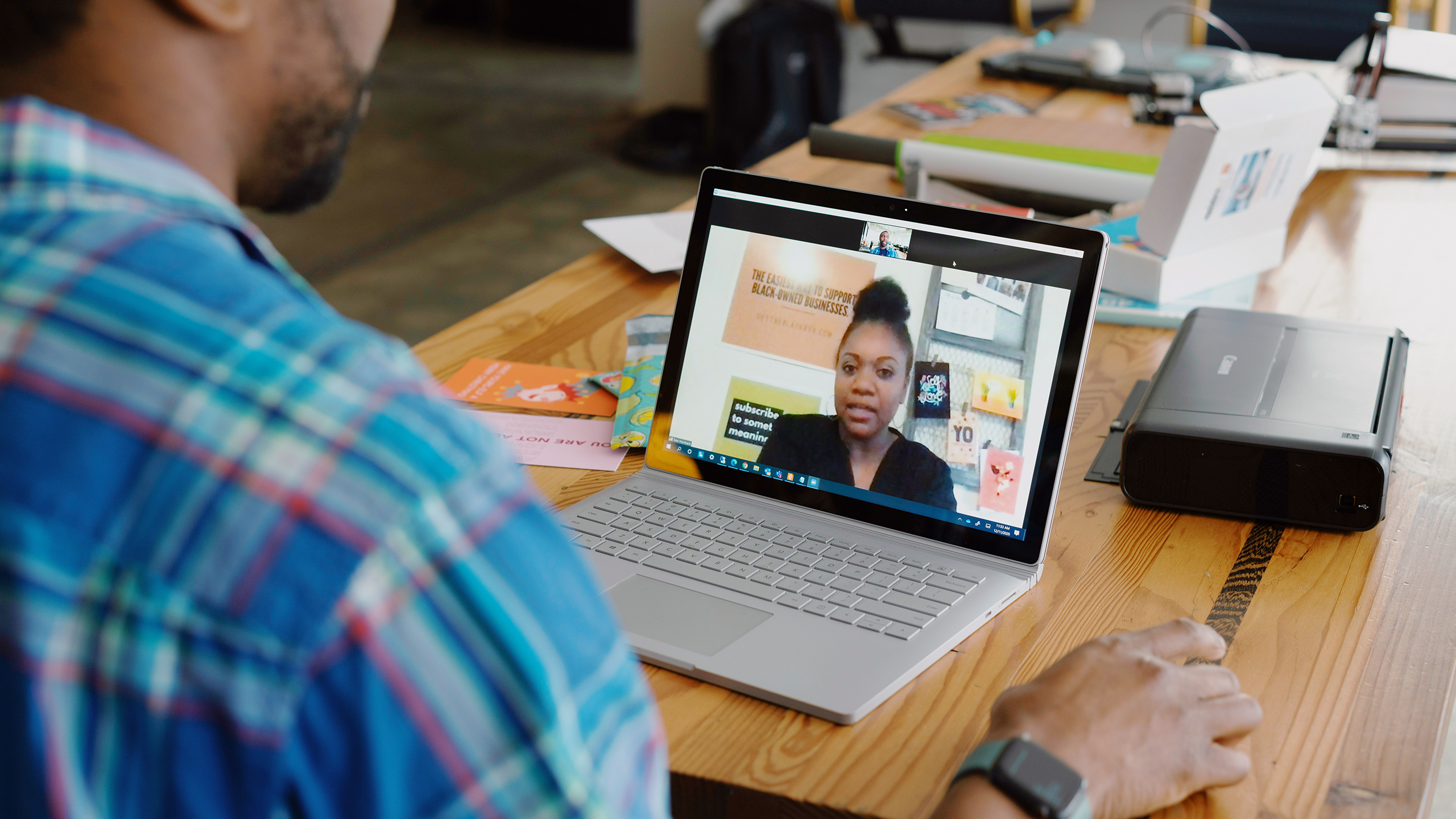 Photo of two people on a Zoom call