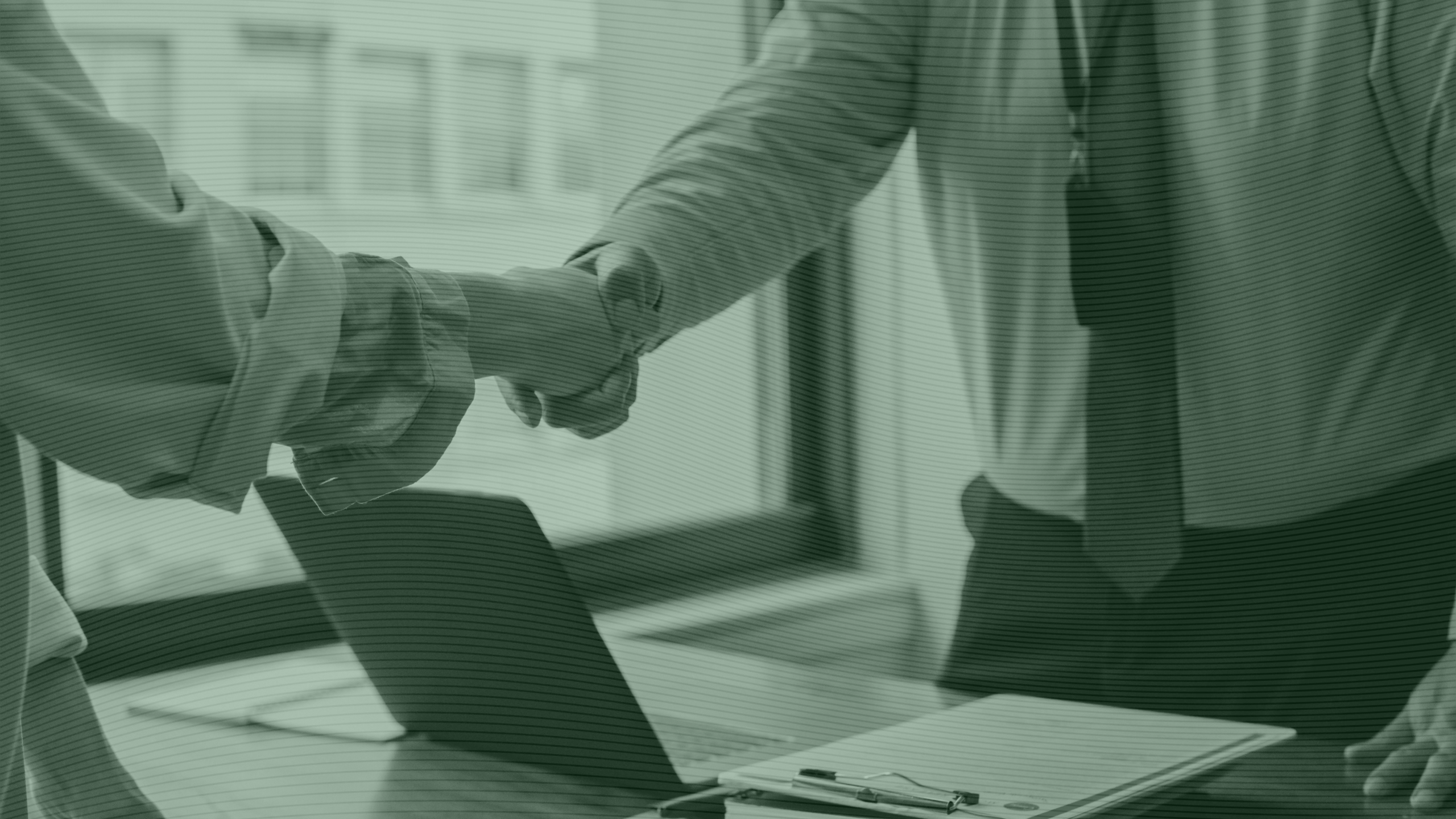 Photo of two business people shaking hands