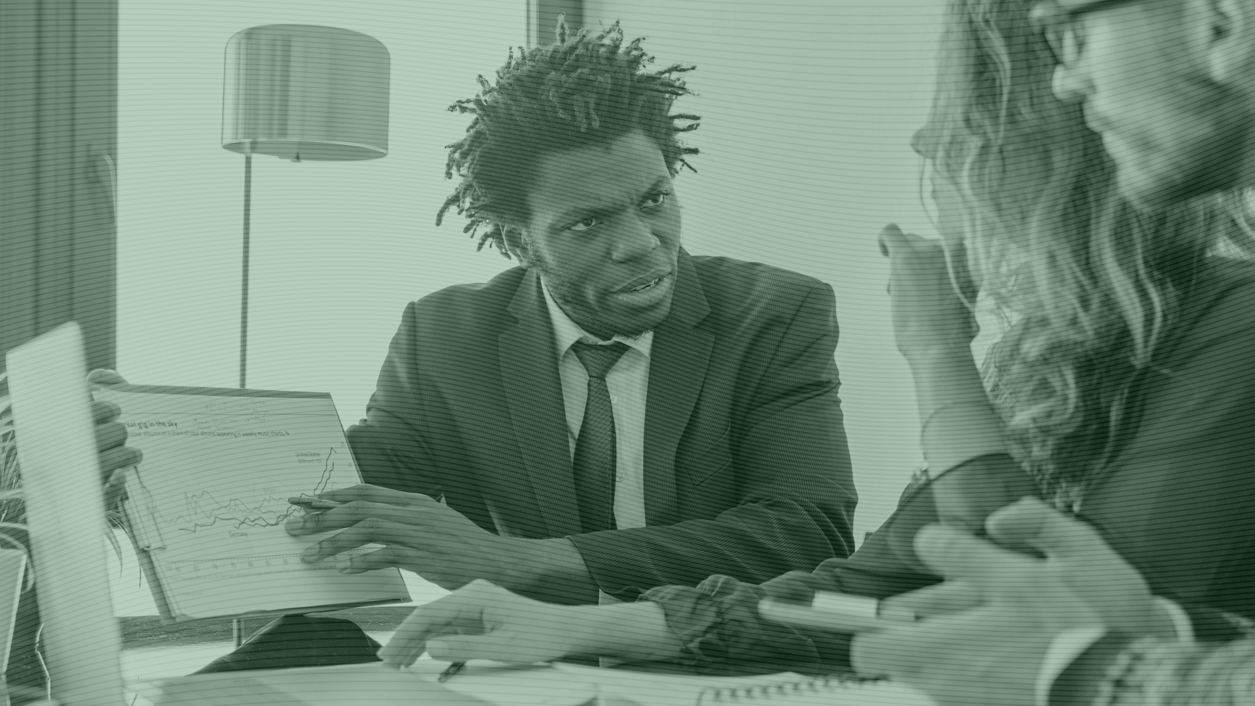 Photo of a financial advisor speaking with clients