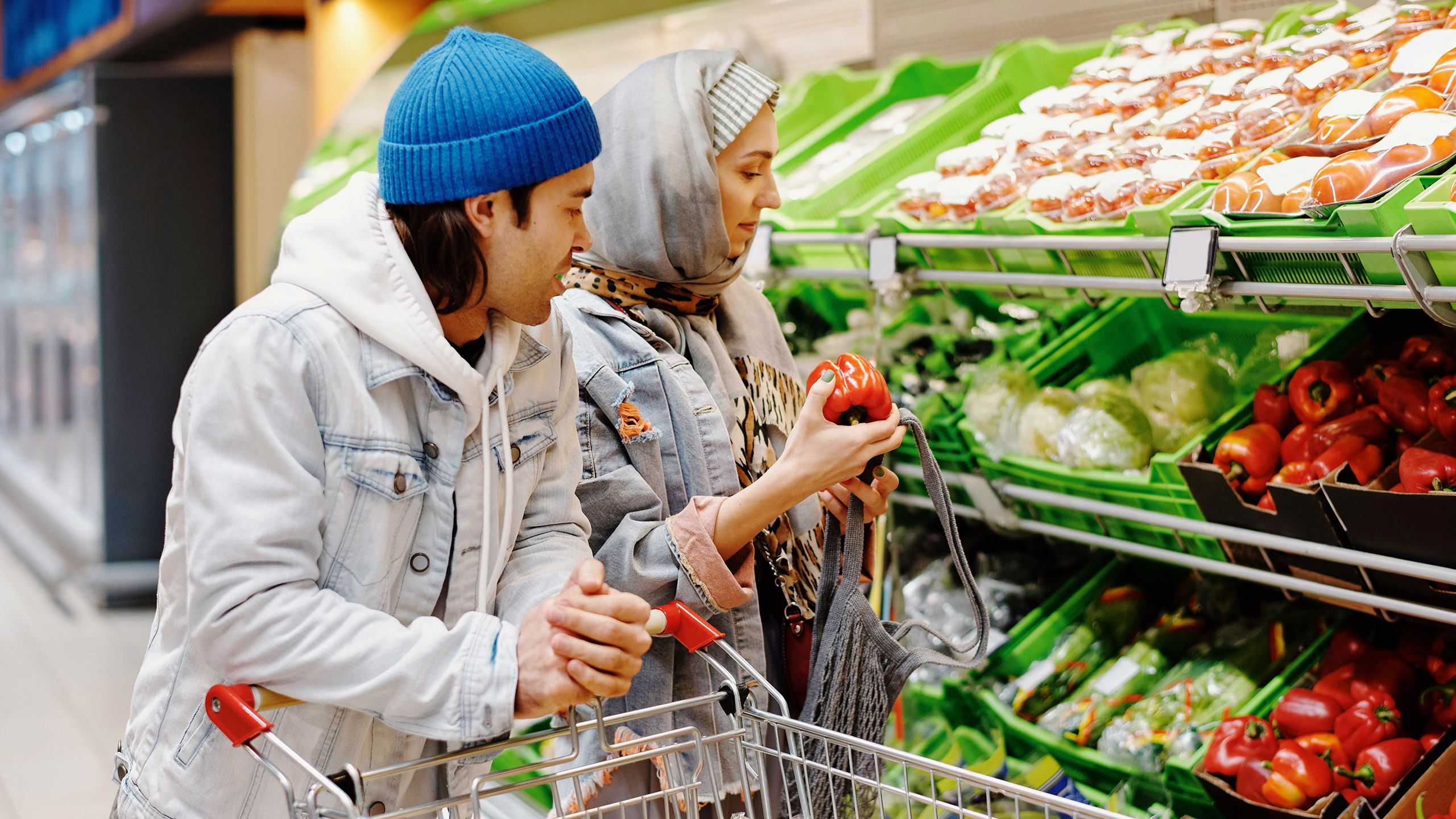 Photo of two people grocery shopping