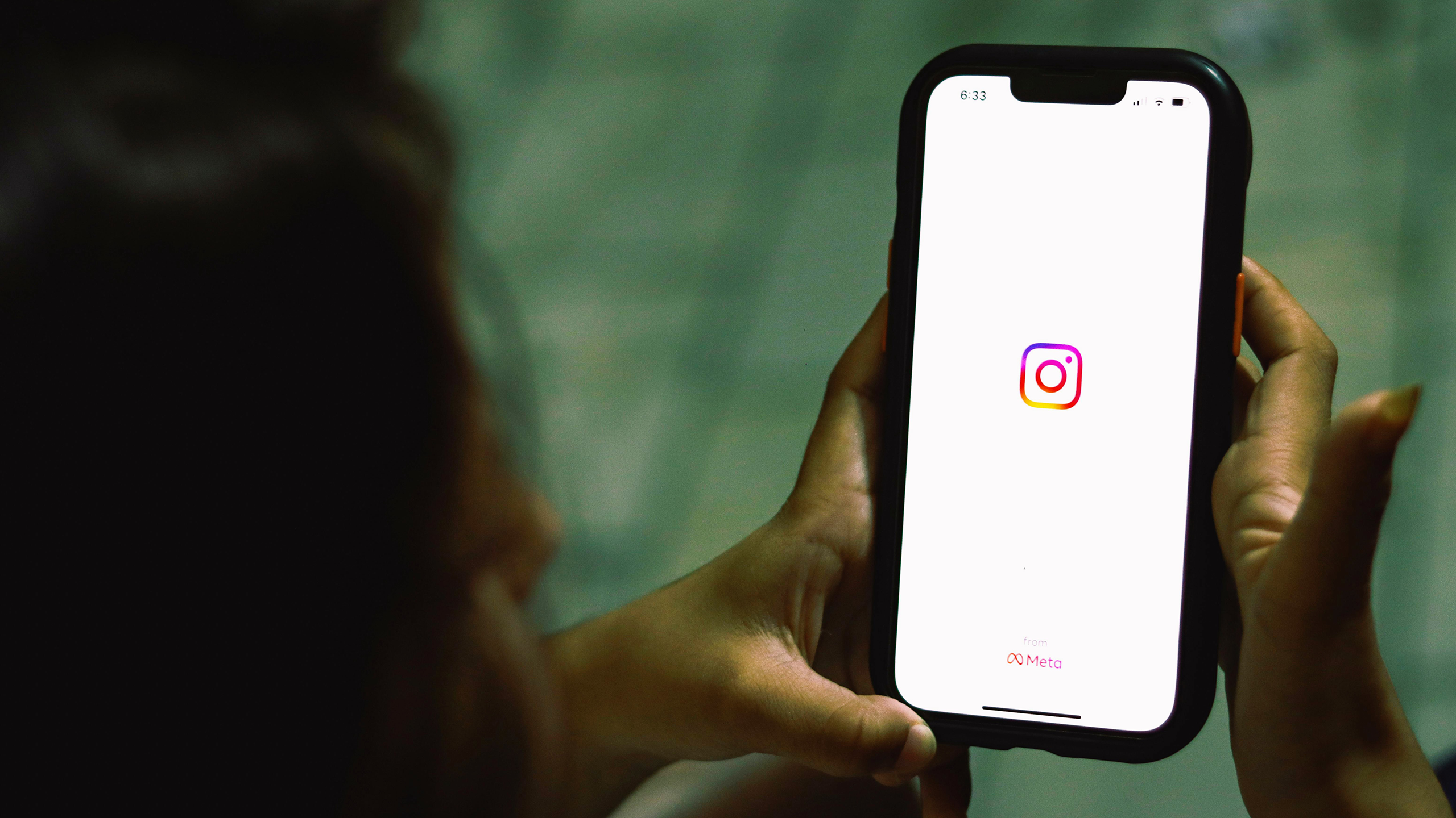 Photo of a person using the Instagram app on an iPhone
