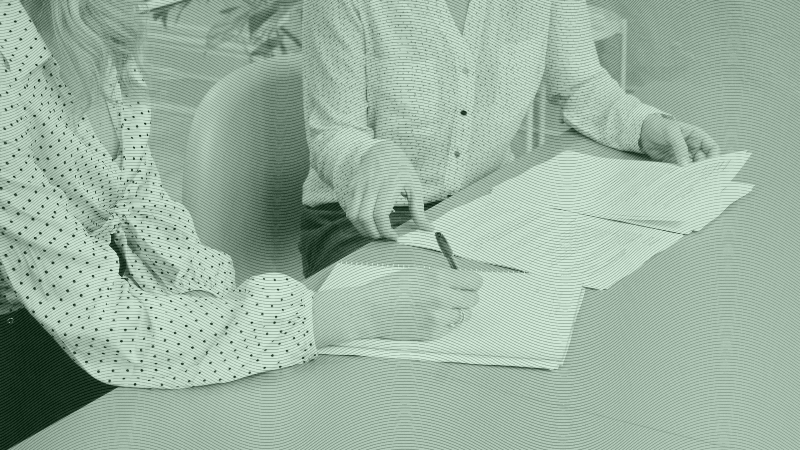 Photo of two women discussing business and looking at documents