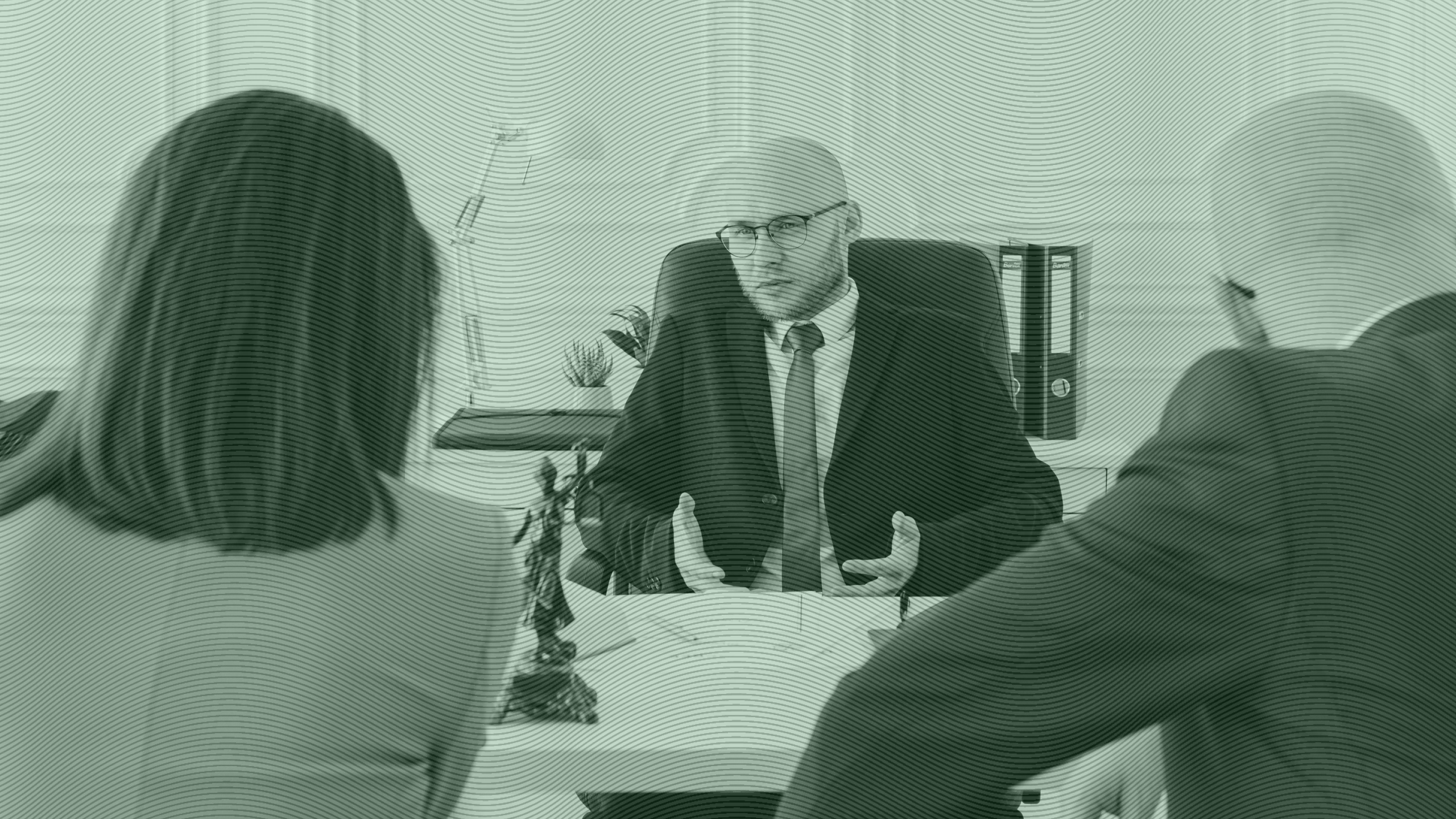 Photo of a financial advisor speaking with clients