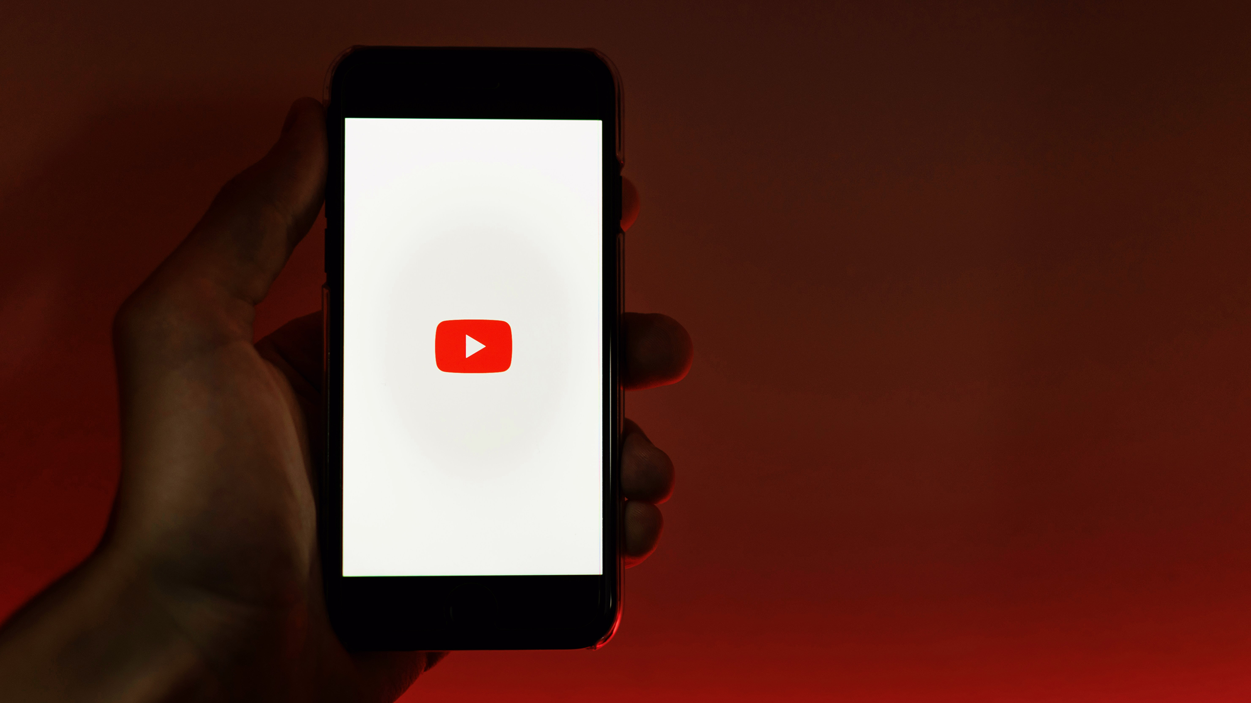 Photo of the YouTube logo on a phone