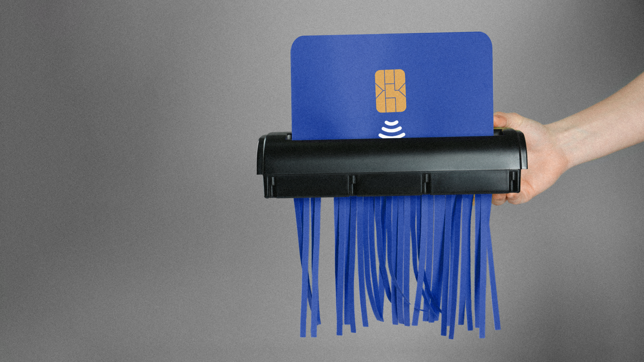 Photo illustration of a credit card going through a paper shredder