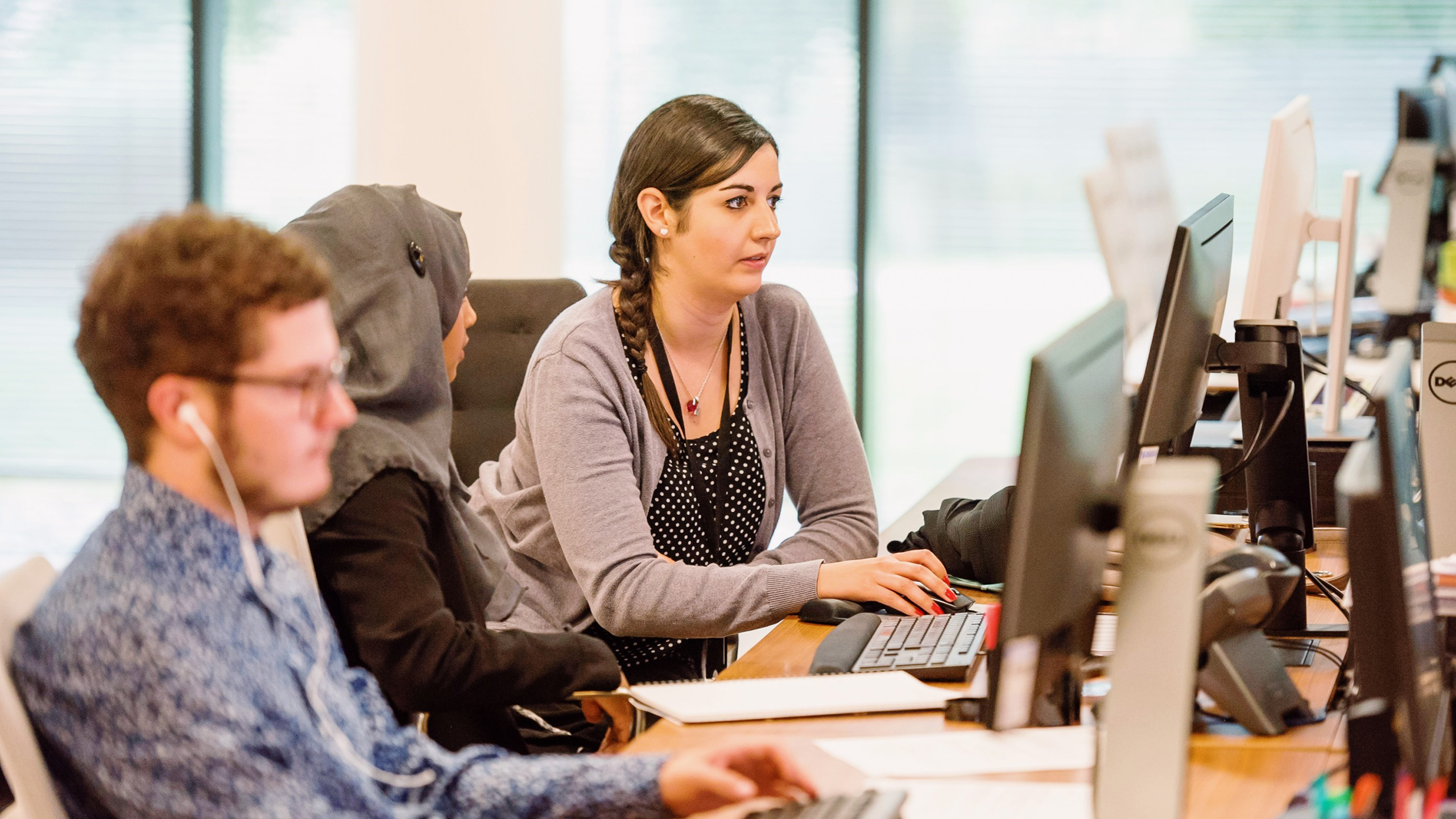 Photo of AI consultants working in an office