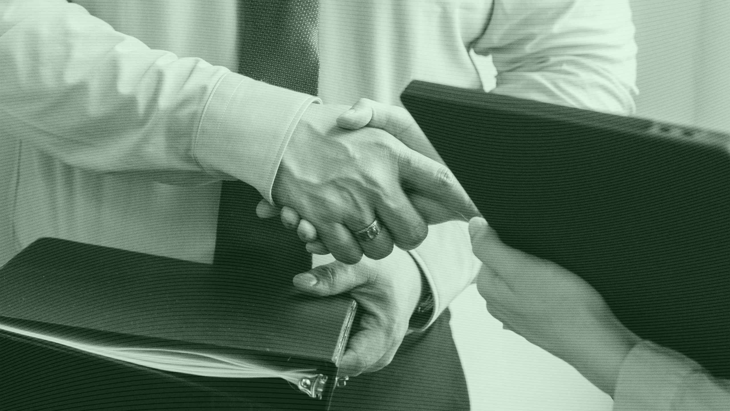 Photo of people shaking hands during a business meeting