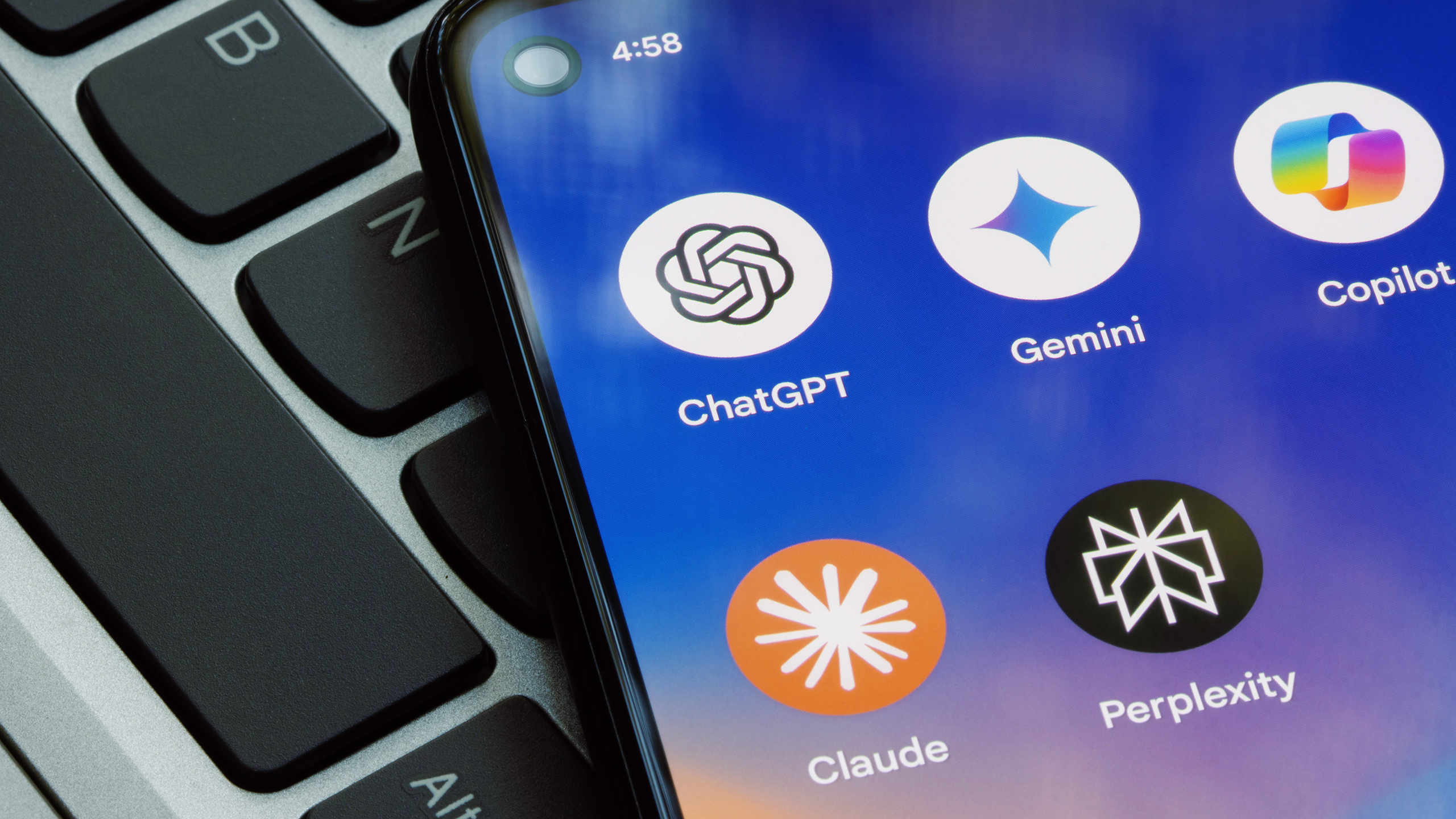 Photo of five AI model logos on a phone