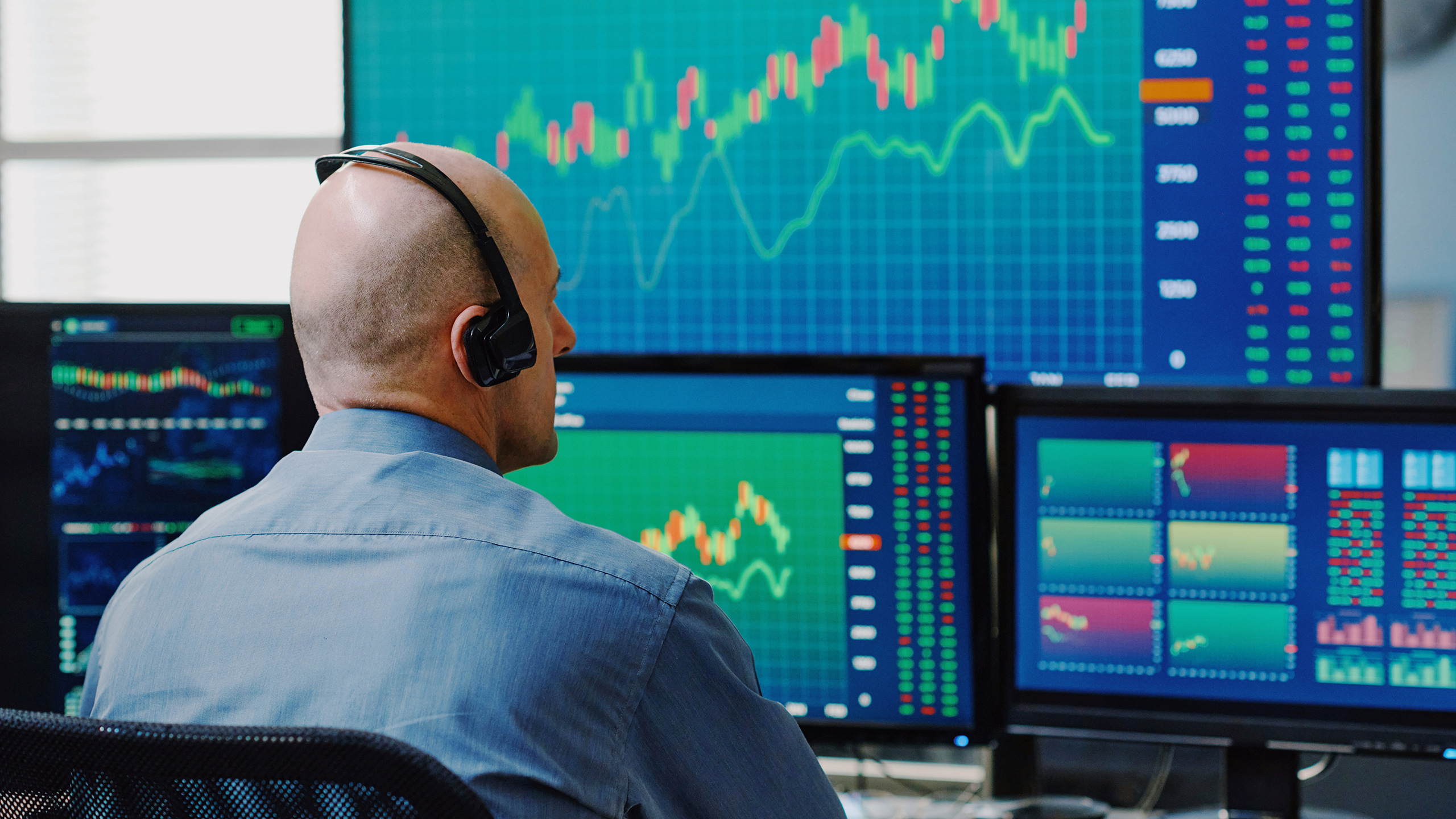 Photo of a trader looking at stock charts