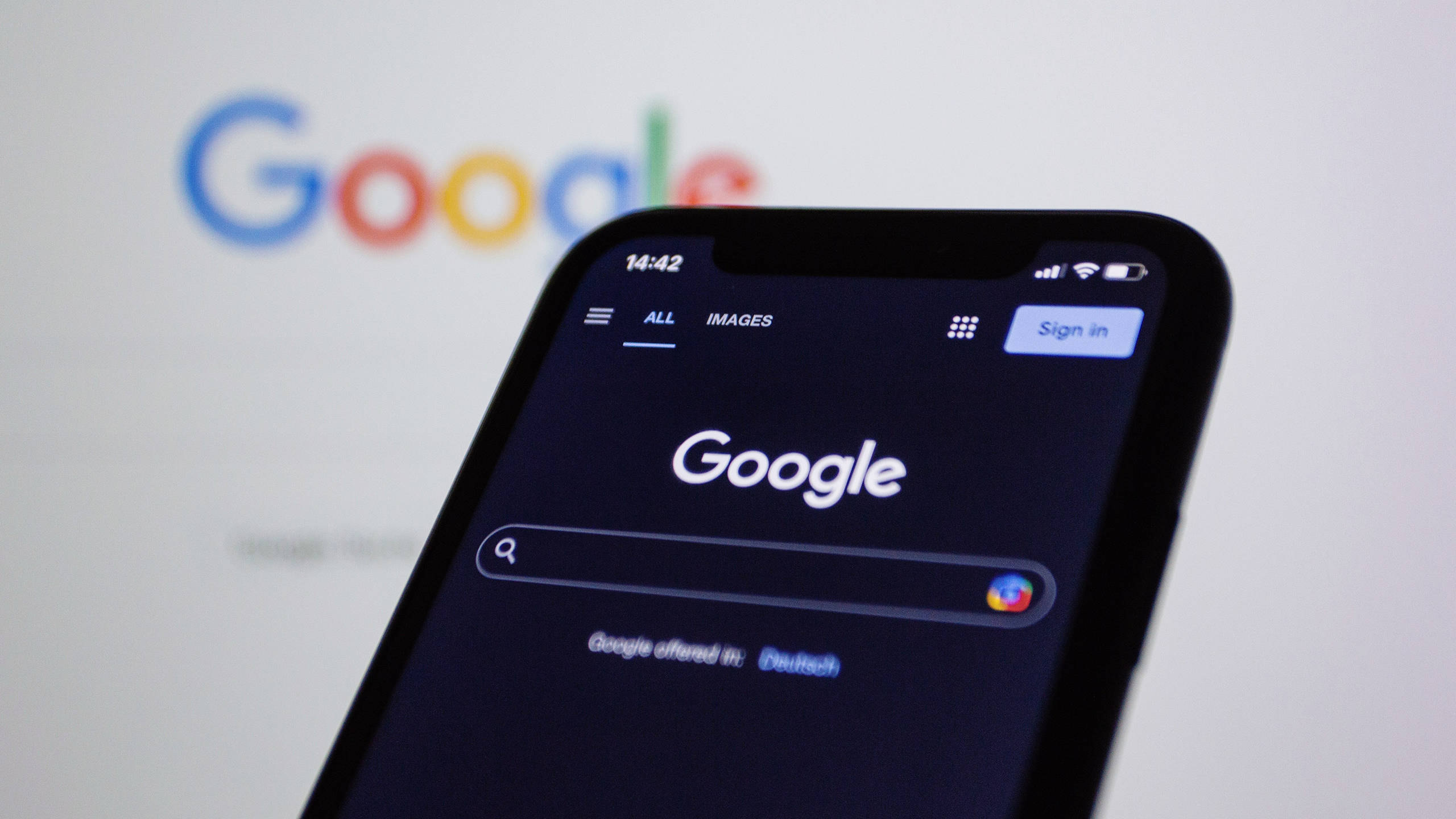 Photo of a phone open to Google search