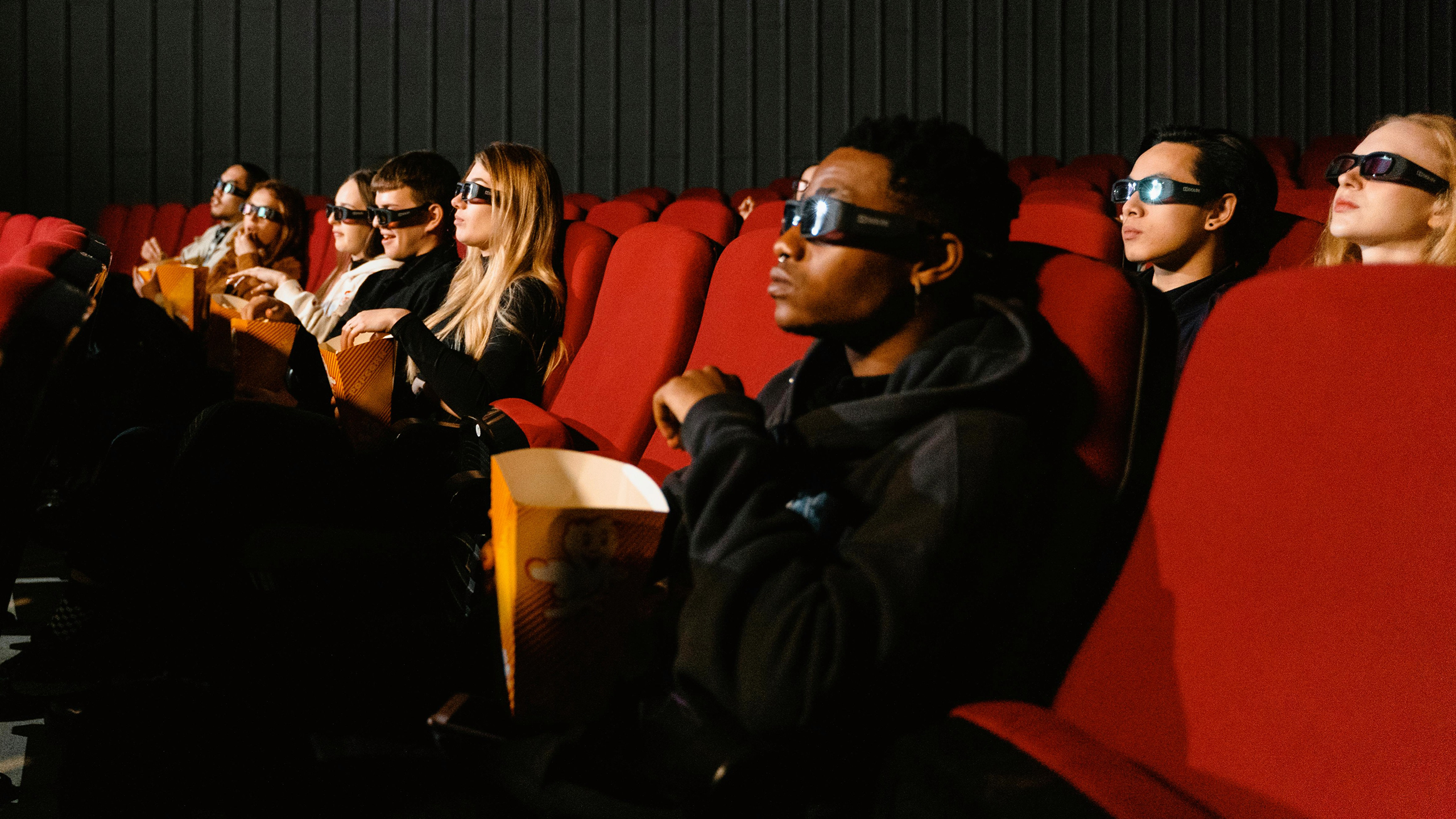 Photo of people watching a movie in a theater