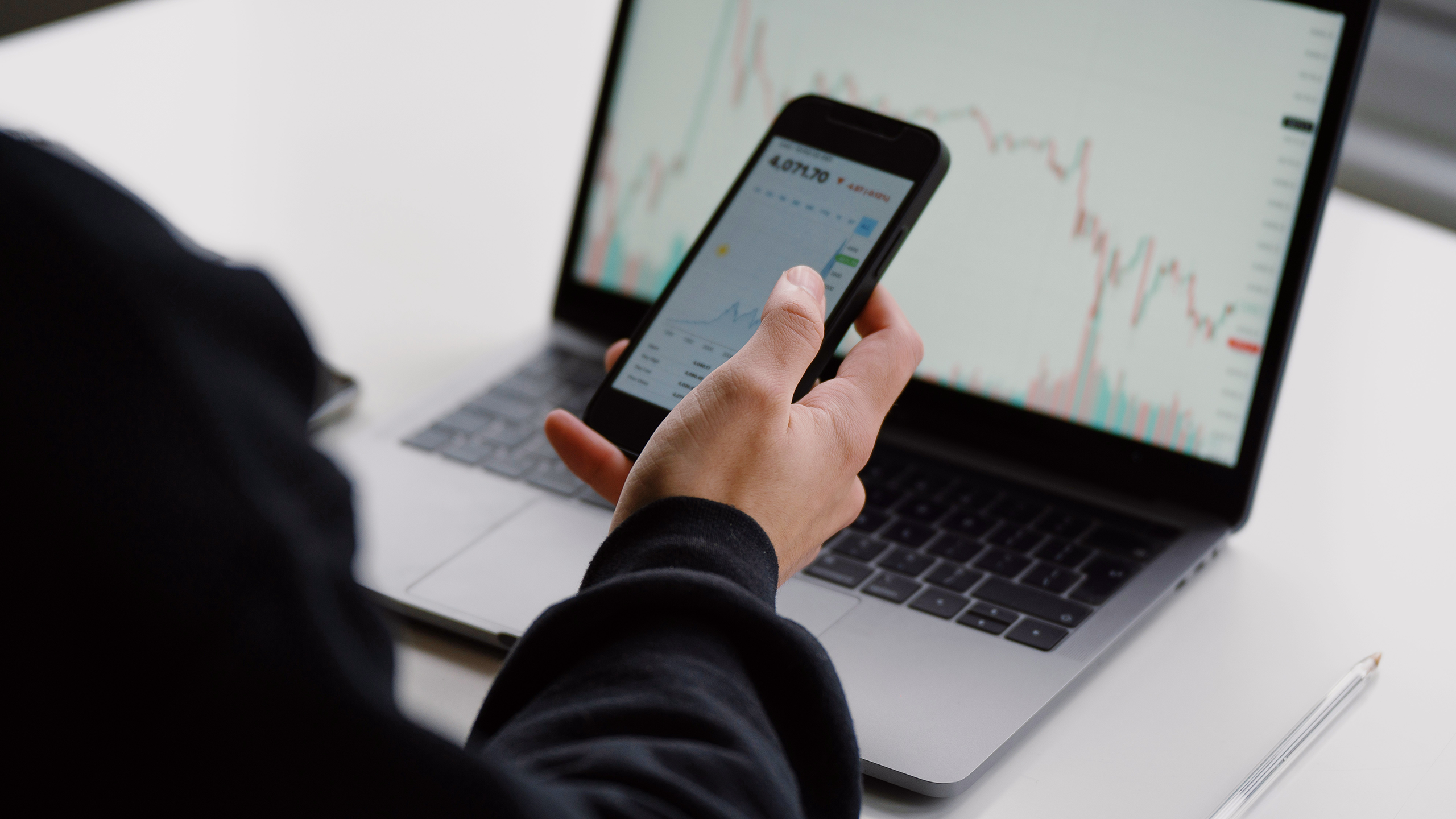 Photo of an investor looking at stock charts
