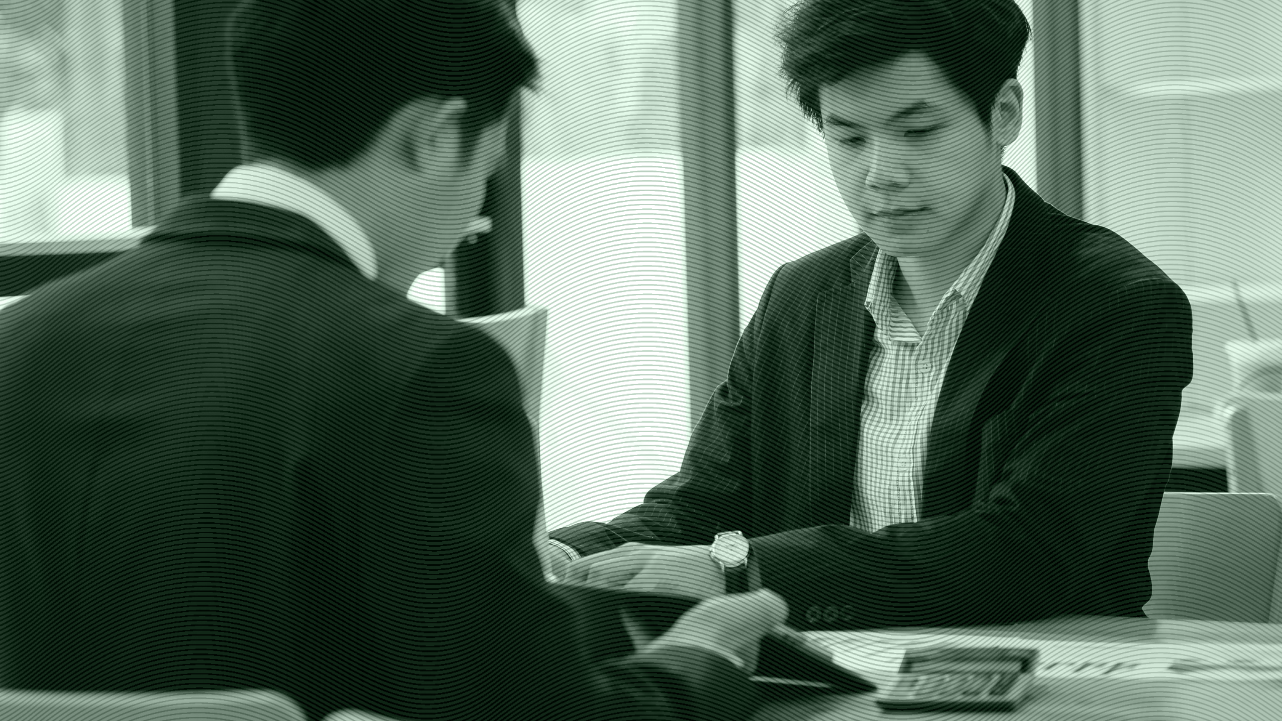 Photo of a younger person in a meeting