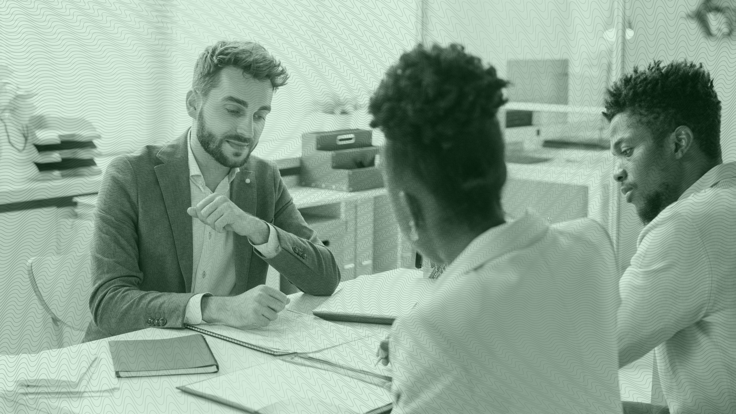 Photo of an advisor meeting with two clients