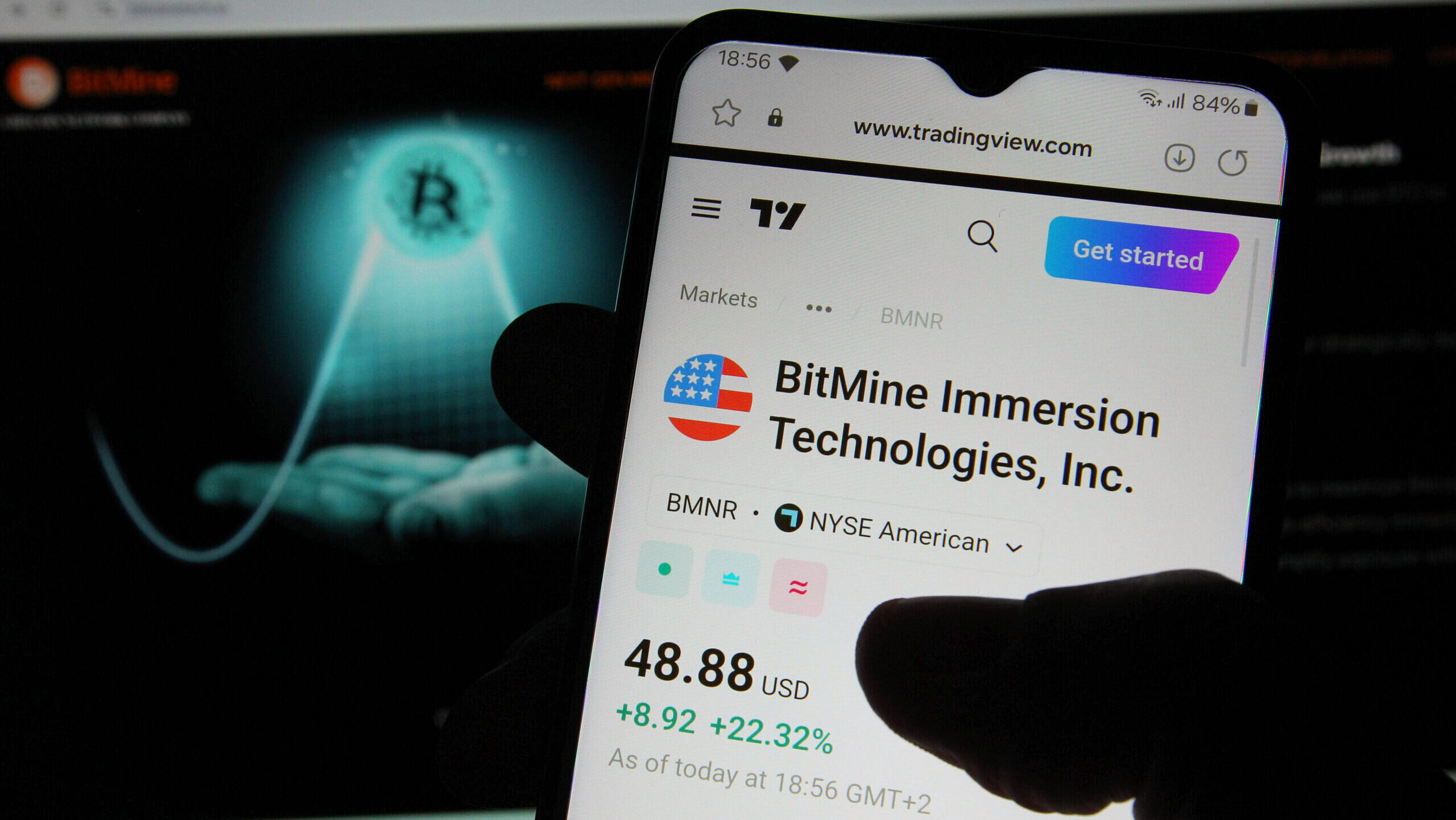 Photo of a smartphone looking at BitMine's share price.