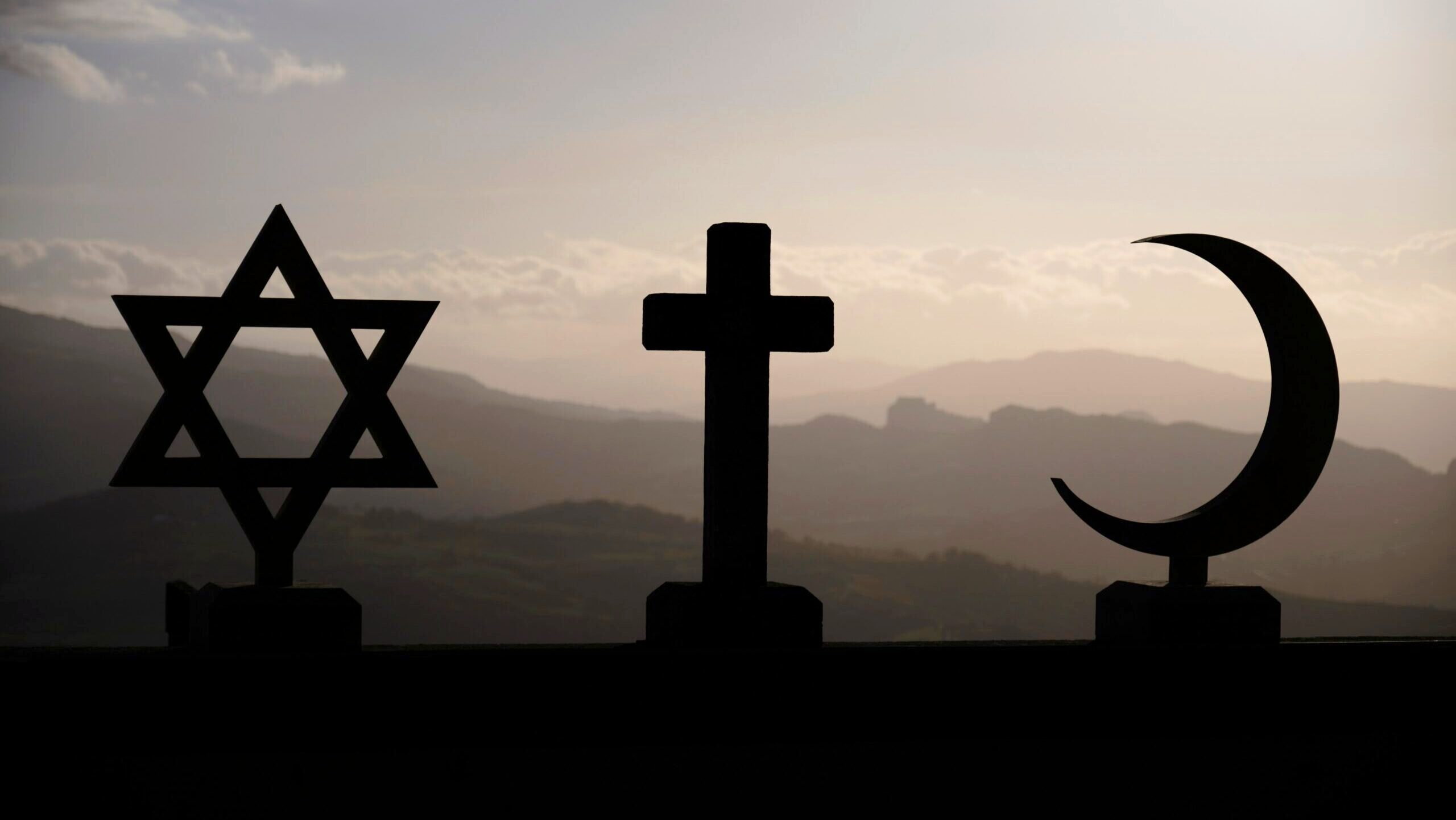 Photo of a cross, a Star of David, and a Crescent of David