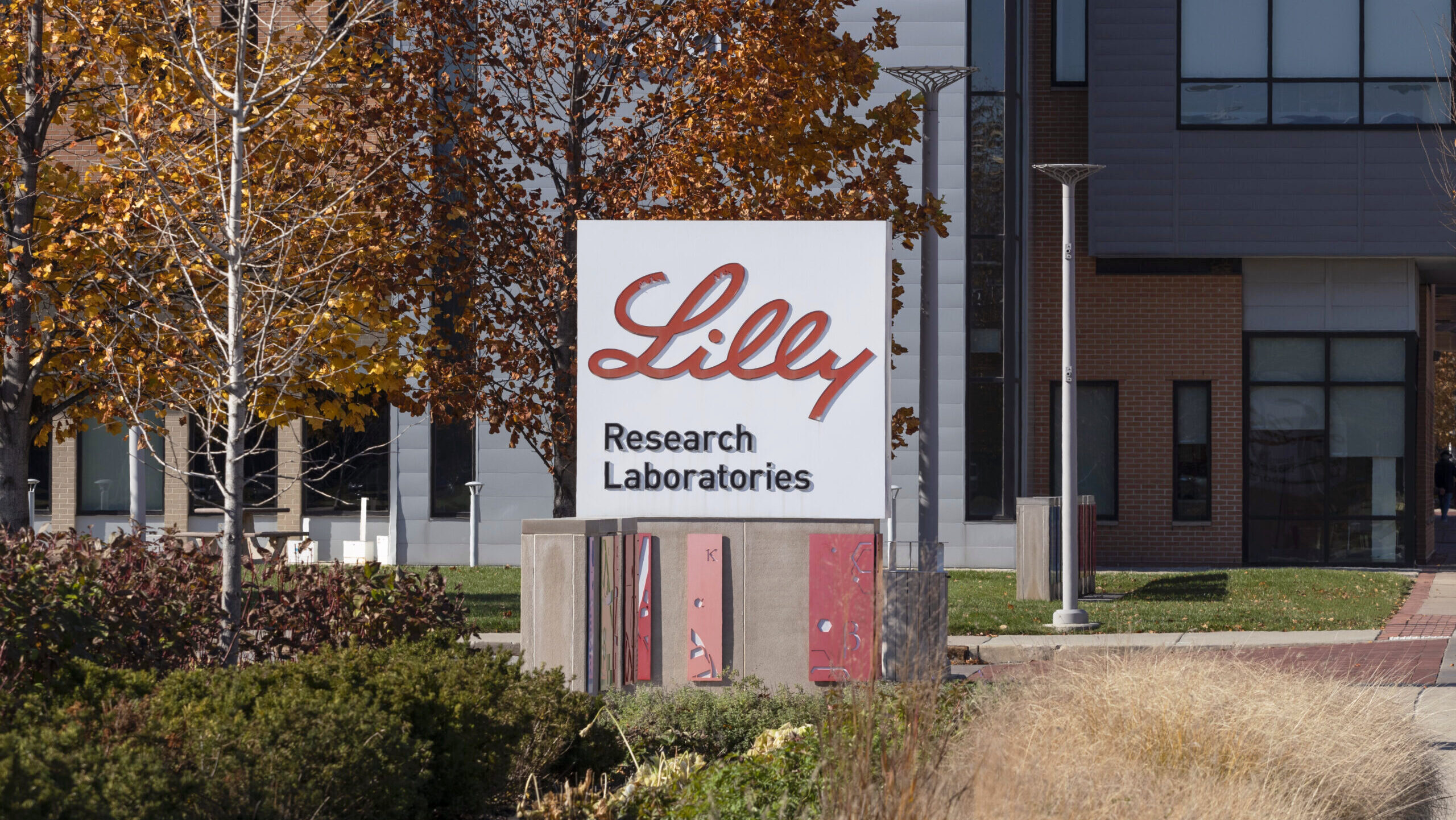 A sign for research laboratories is shown in front of a building at Eli Lilly's world headquarters.