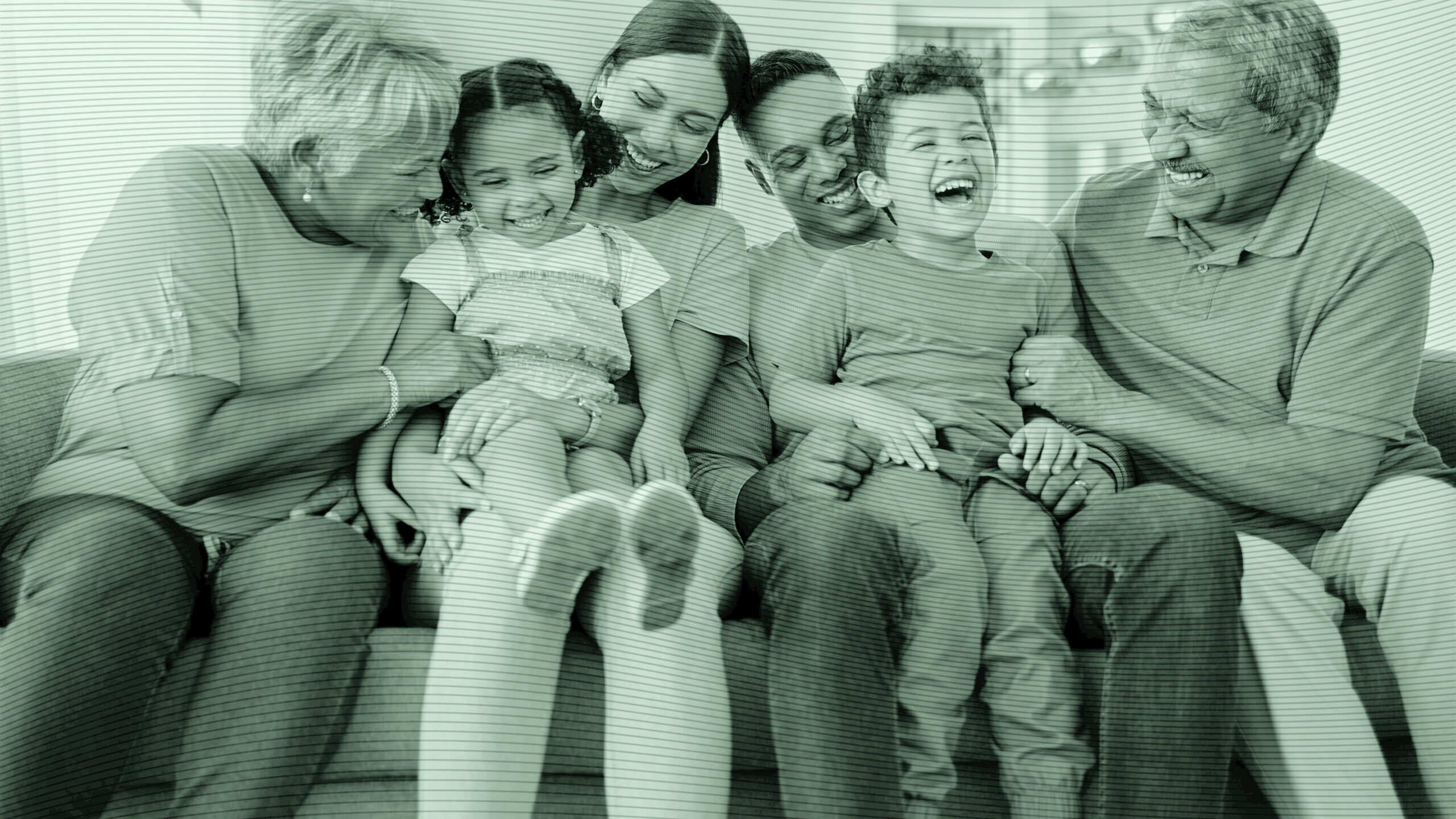 A photo of a family on the couch.