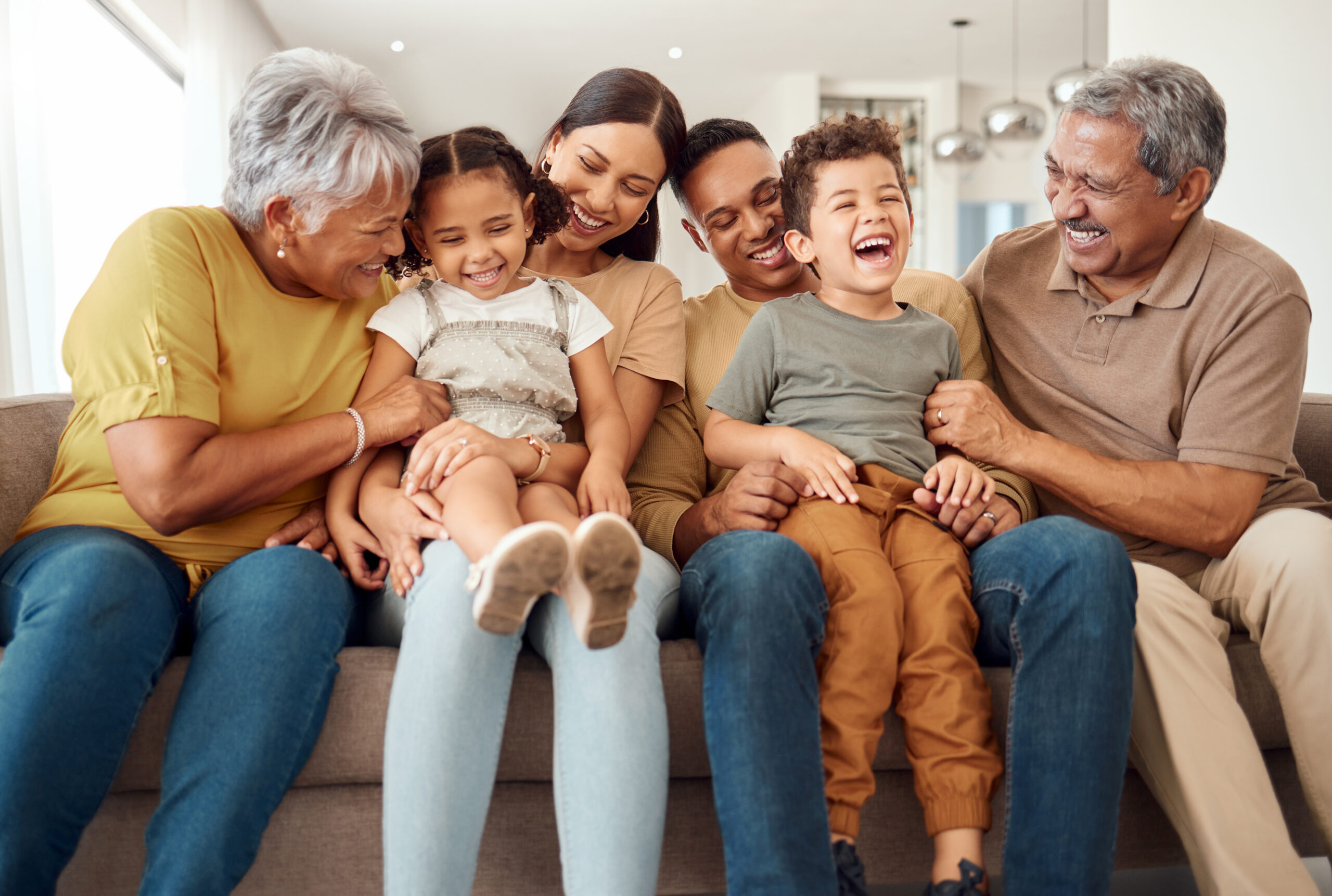 A photo of a family on the couch.