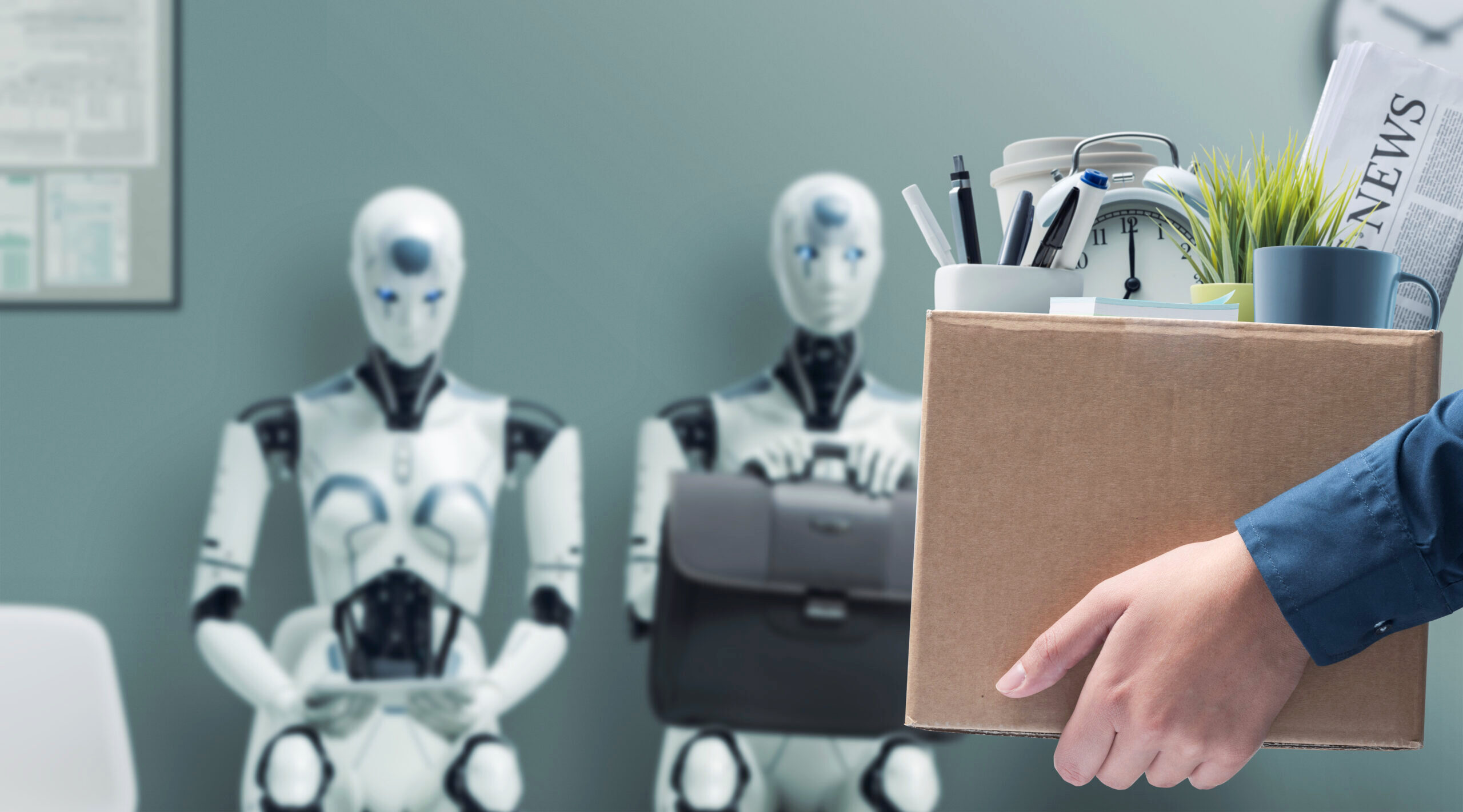 Fired office worker holding a box with her belongings and leaving the office, humanoid AI robots waiting for a job interview in the background: the impact of artificial intelligence and robotics on unemployment