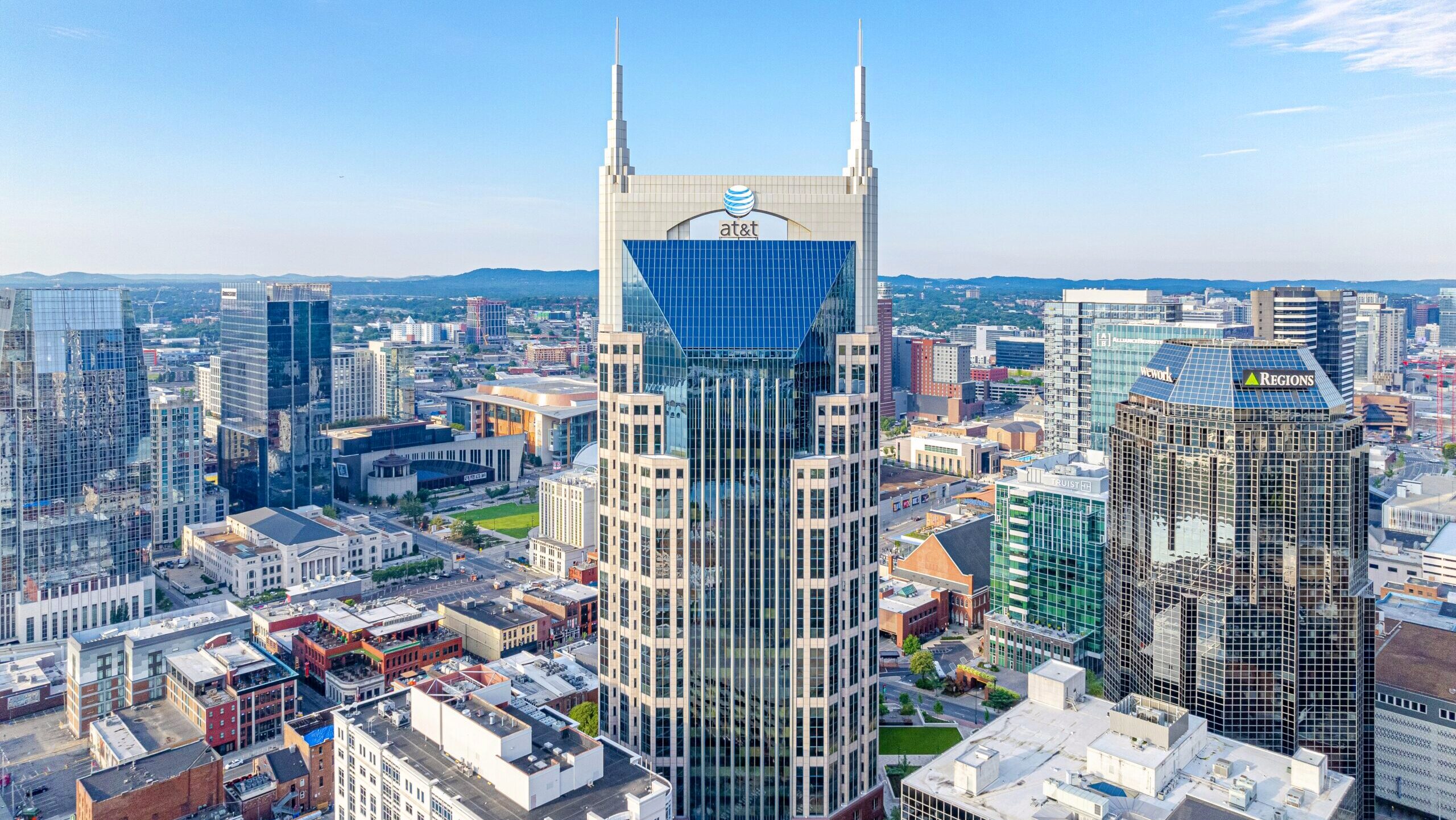 The AT&T buiding in downtown Nashville, TN features the company's logo atop the city skyline.