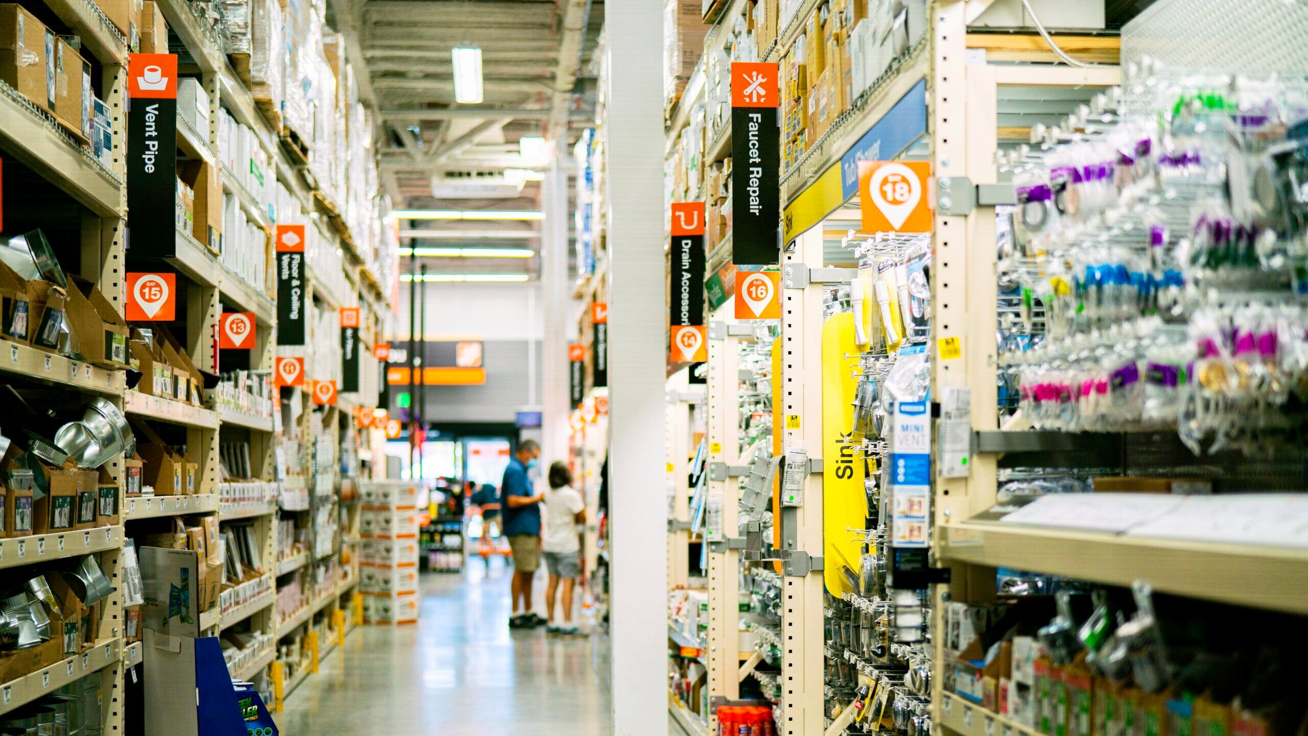 Shoppers are shown browsing in the aisle of a Home Depot location in Pasadena, California.