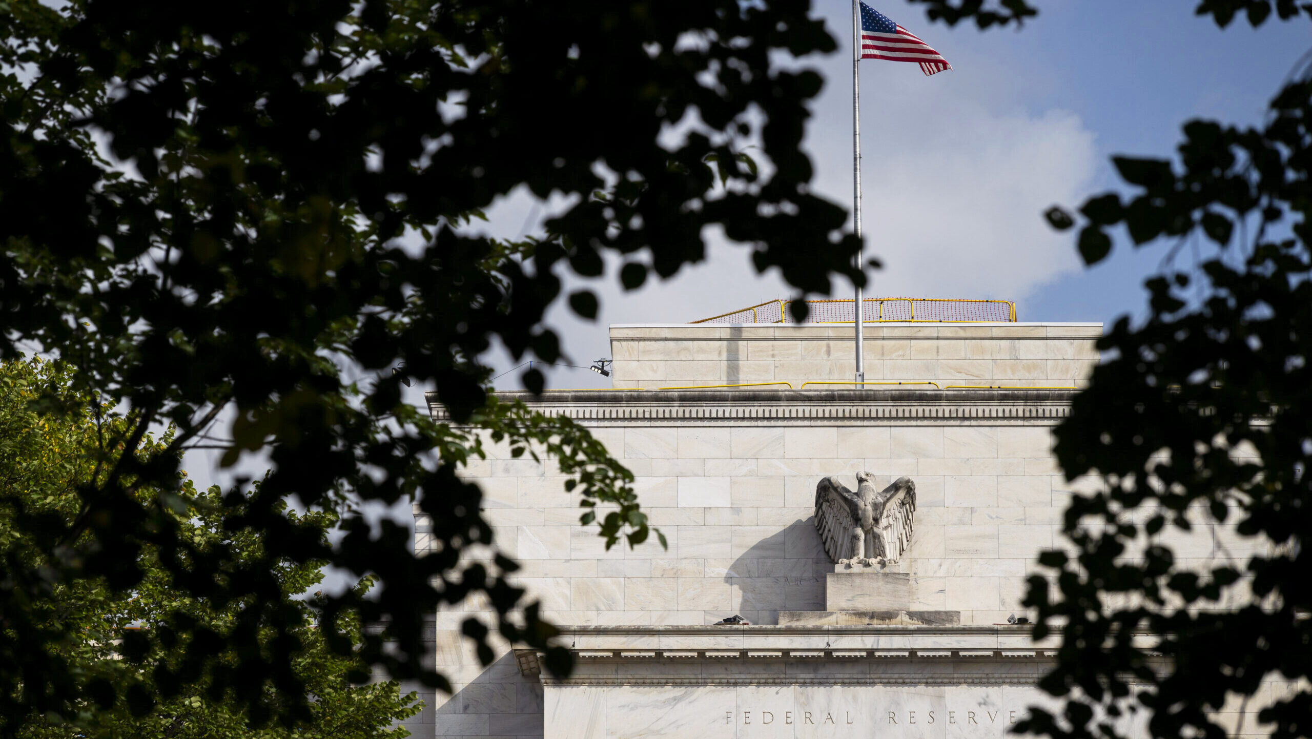 The US flag flies above the Federal Reserve's Eccles Building in Washington, D.C.