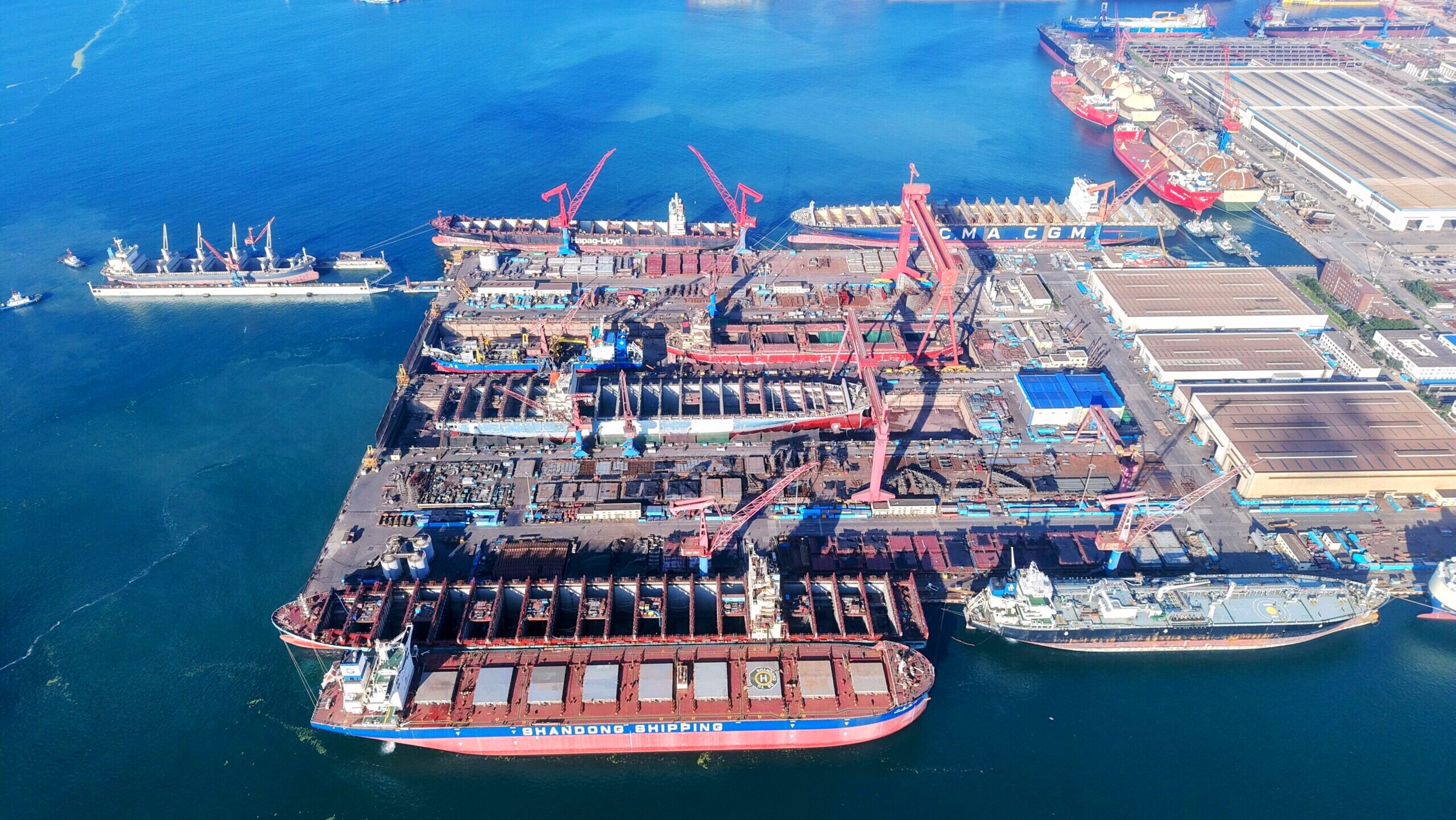 Several giant ships of over 100,000 tons are shown under construction at a China State Shipbuilding Corporation facility in Qingdao City.