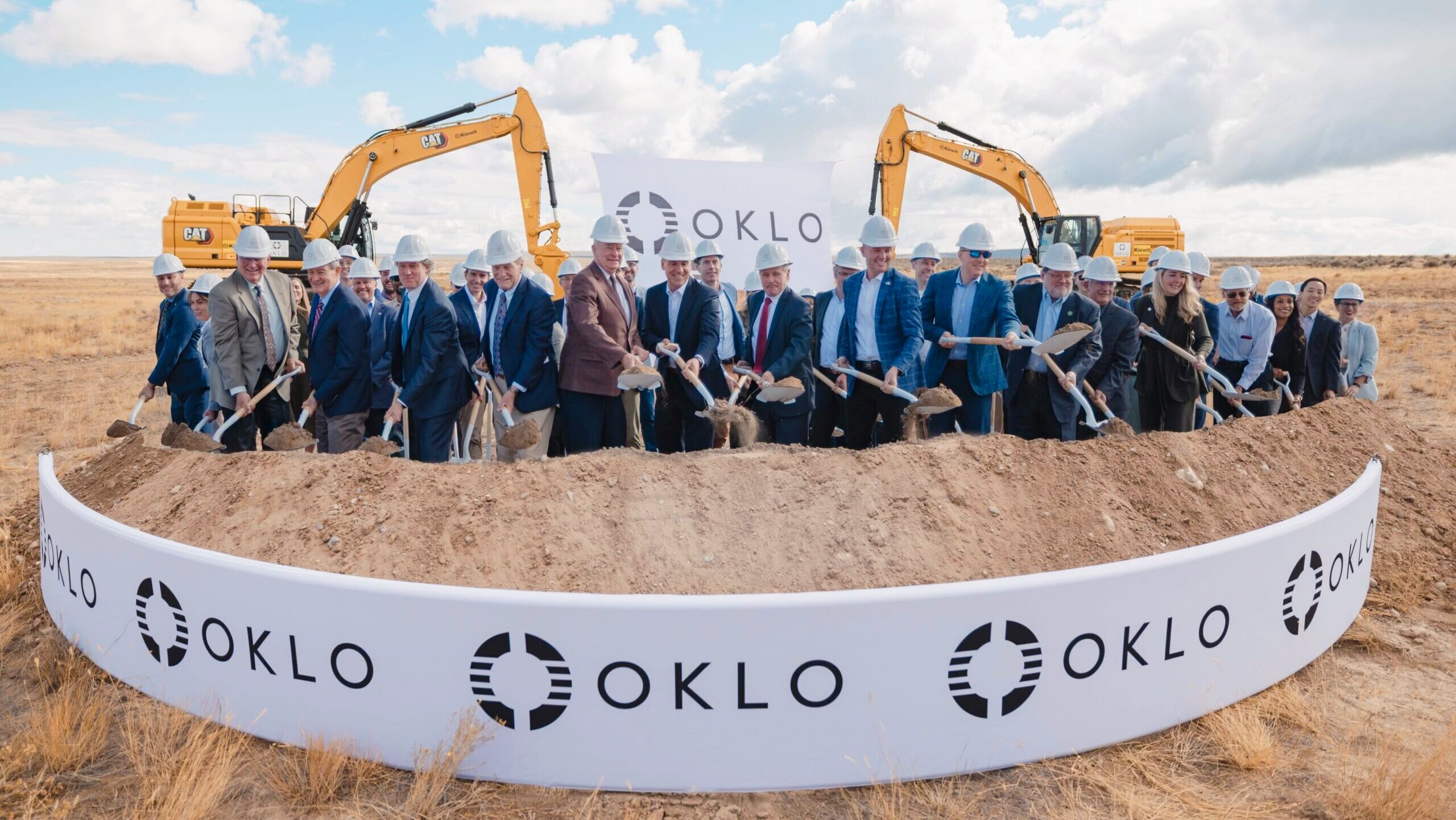 Oklo executives and staff are shown breaking ground on its first Aurora powerhouse at Idaho National Laboratory under the U.S. Department of Energy’s newly established Reactor Pilot Program.