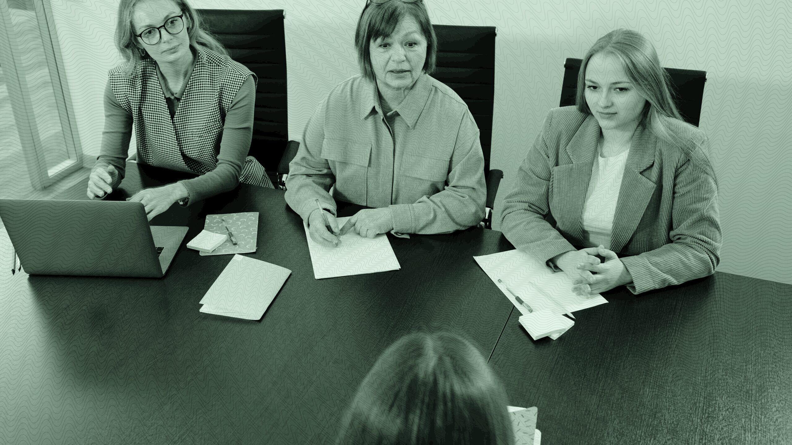 Three women in a client meeting