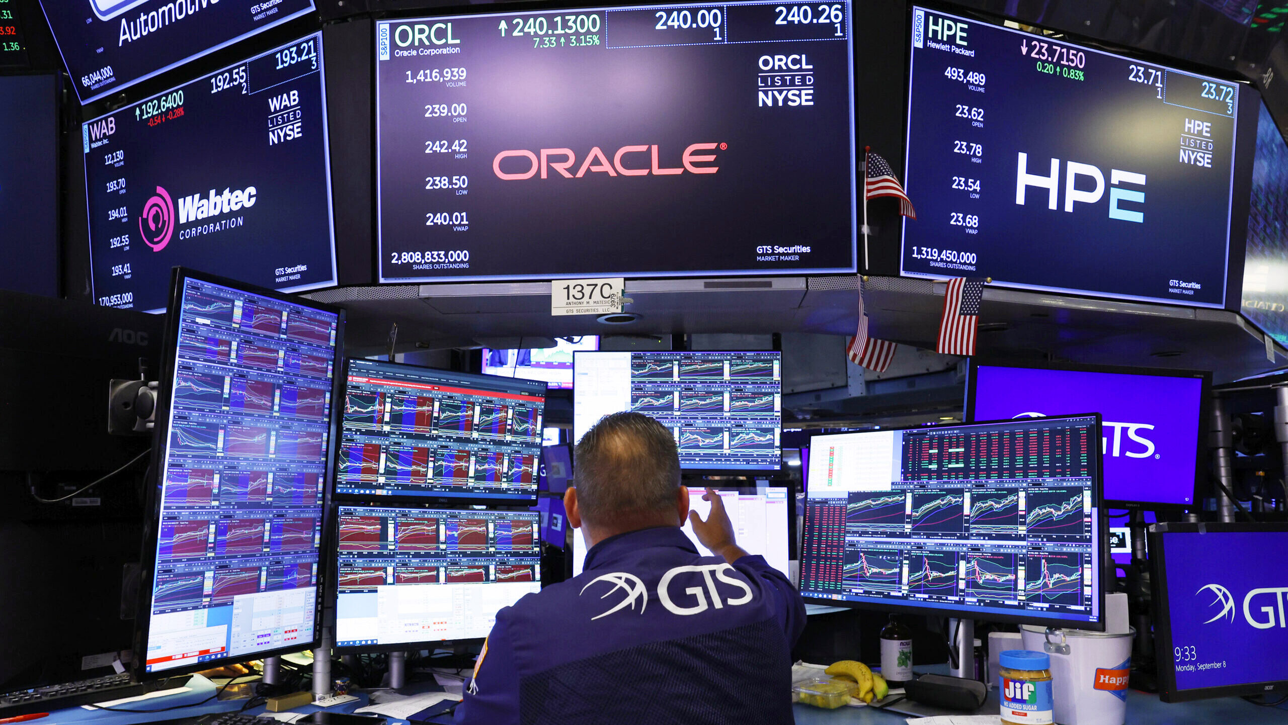 A trader is shown working on the floor of the New York Stock Exchange on Wall Street.