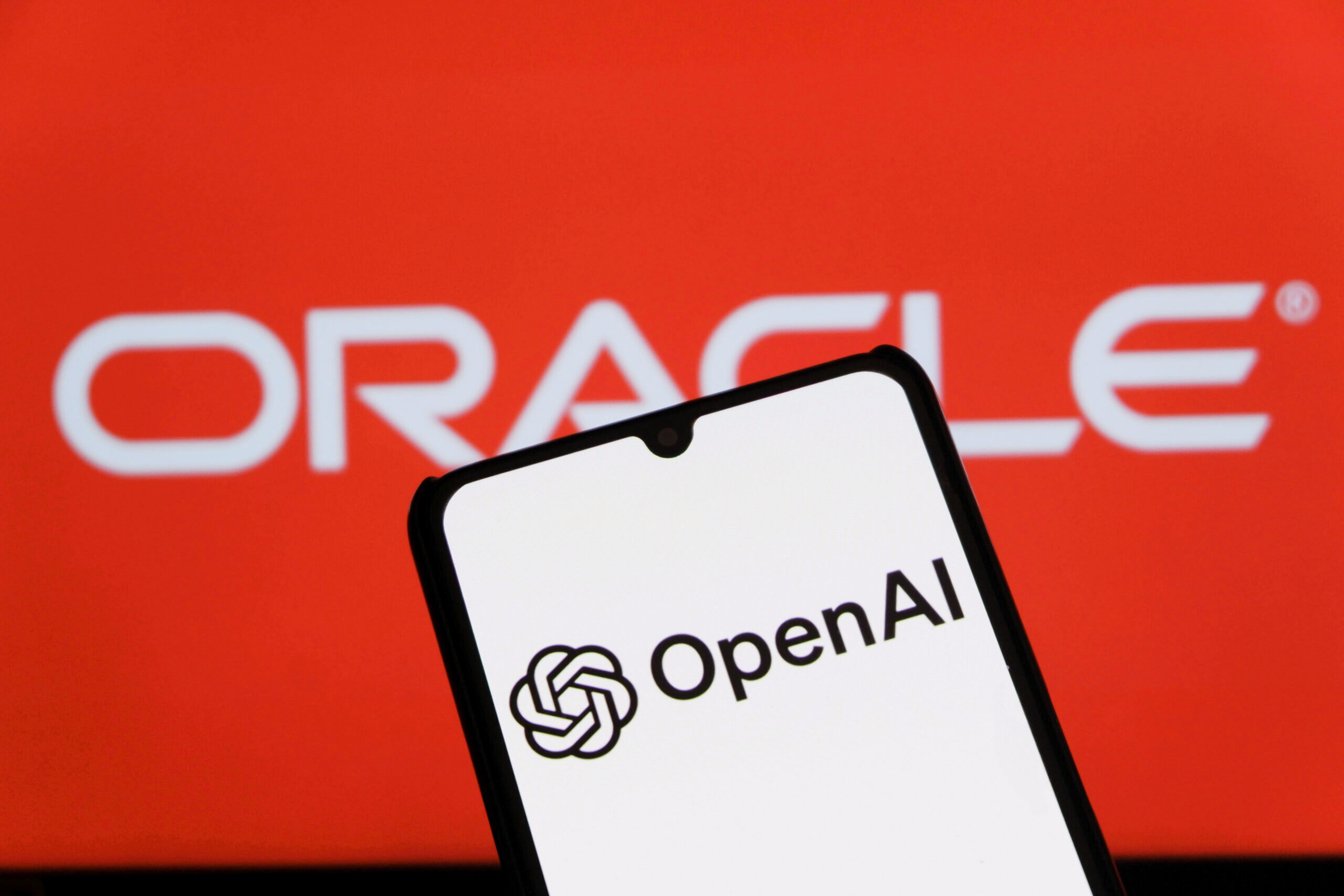 September 12, 2025, Indonesia: In this photo illustration, the OpenAI logo displayed on a smartphone with qn ORACLE logo in the background. (Credit Image: © Algi Febri Sugita/SOPA Images via ZUMA Press Wire) (Newscom TagID: zumaglobalsixteen607294.jpg) [Photo via Newscom]