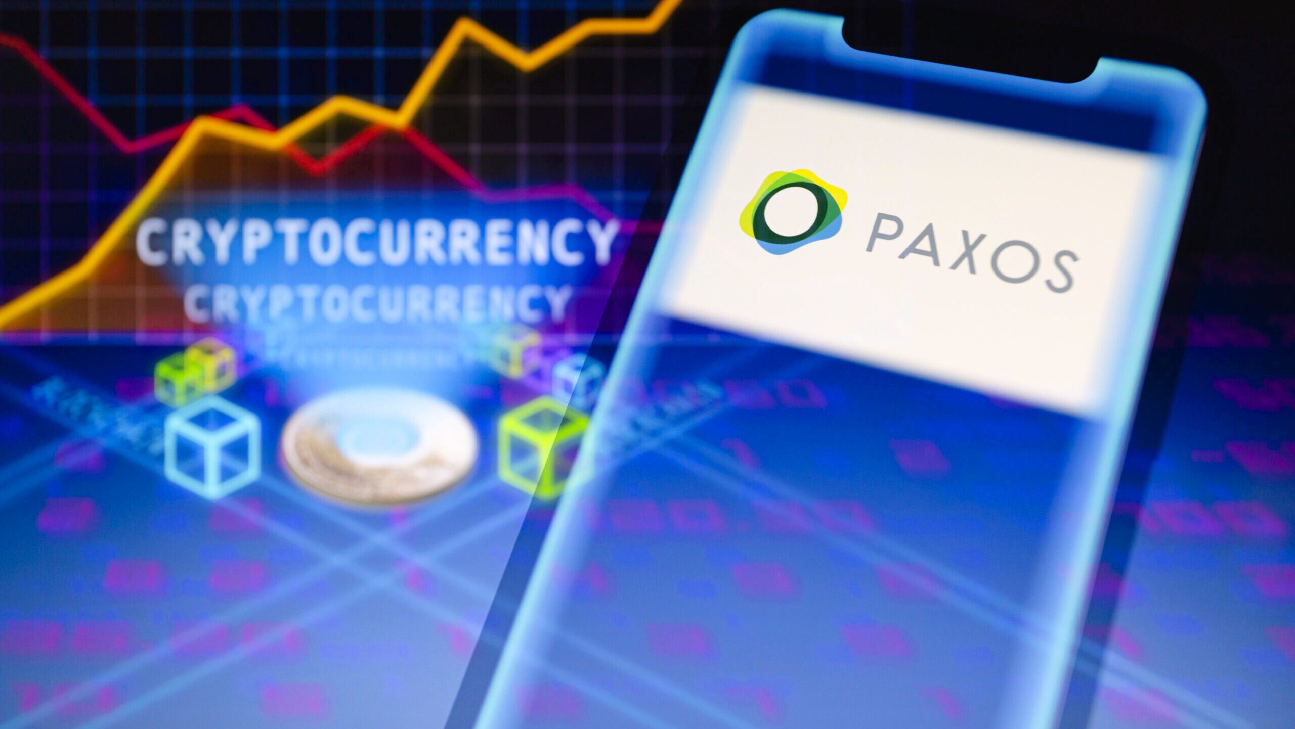 A view of the Paxos logo is displayed on a smartphone backdropped by visual representation of cryptocurrency and the blockchain.
