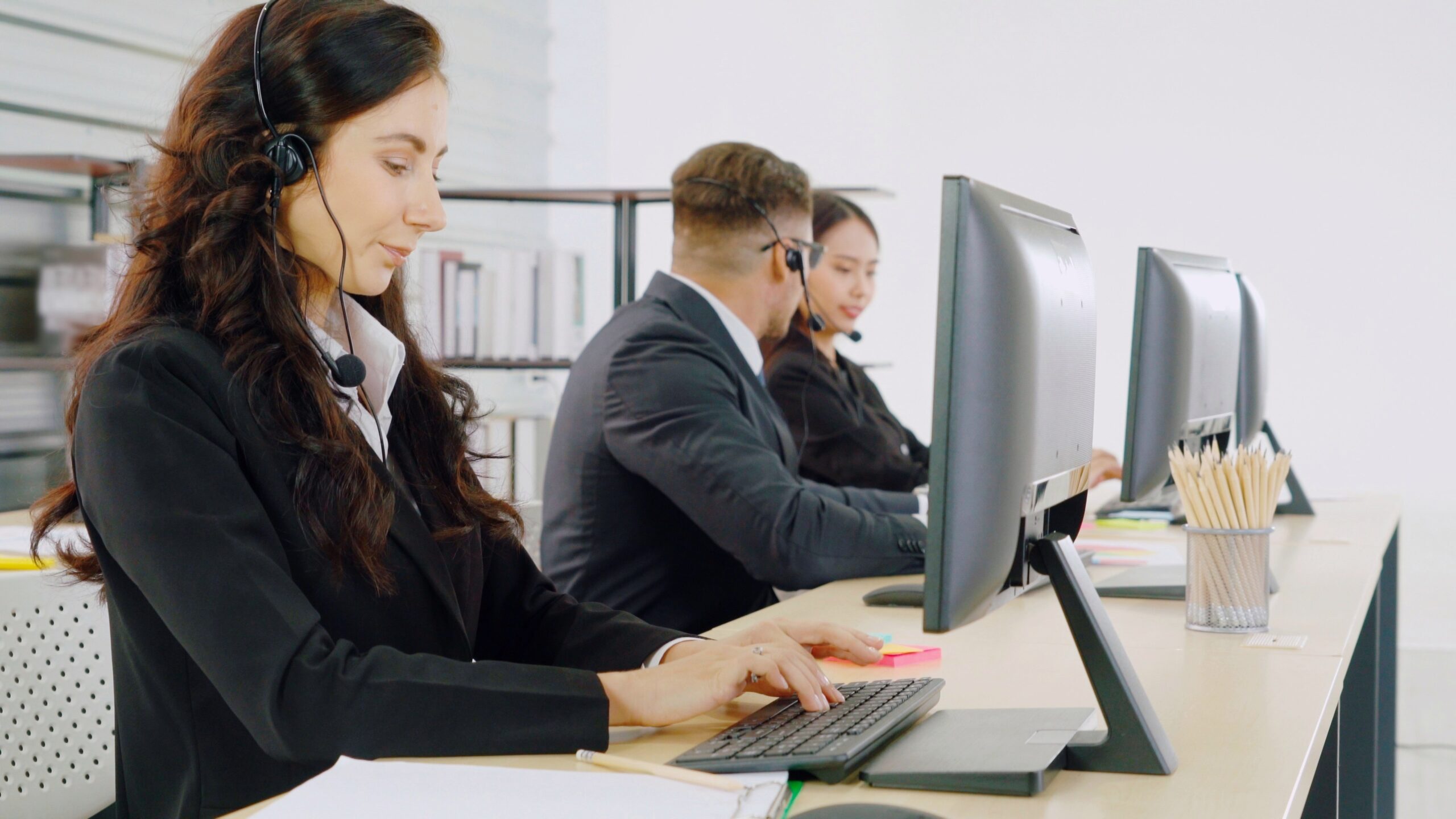 Photo of three IT agents working