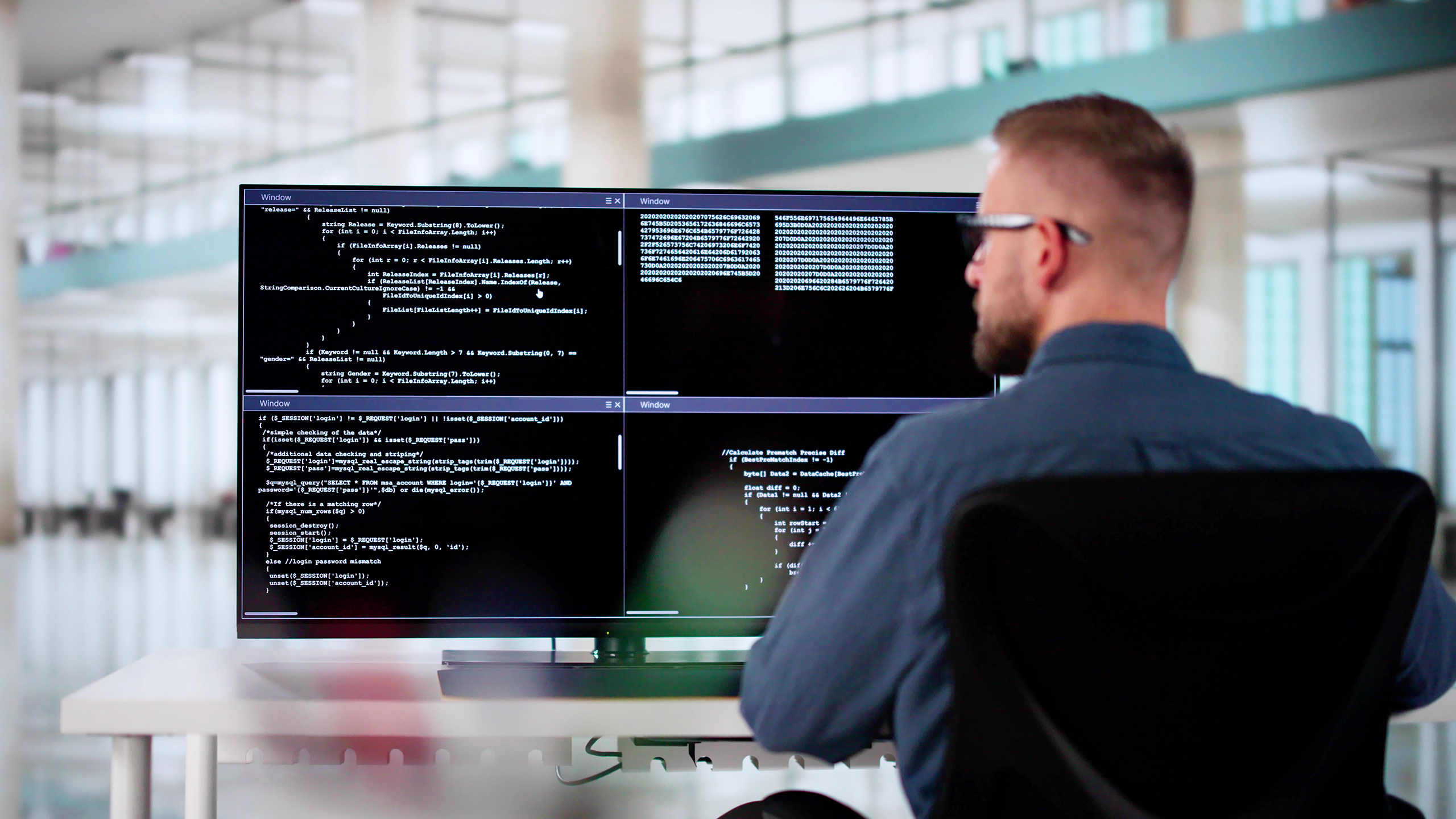 Photo of a computer programmer at work.