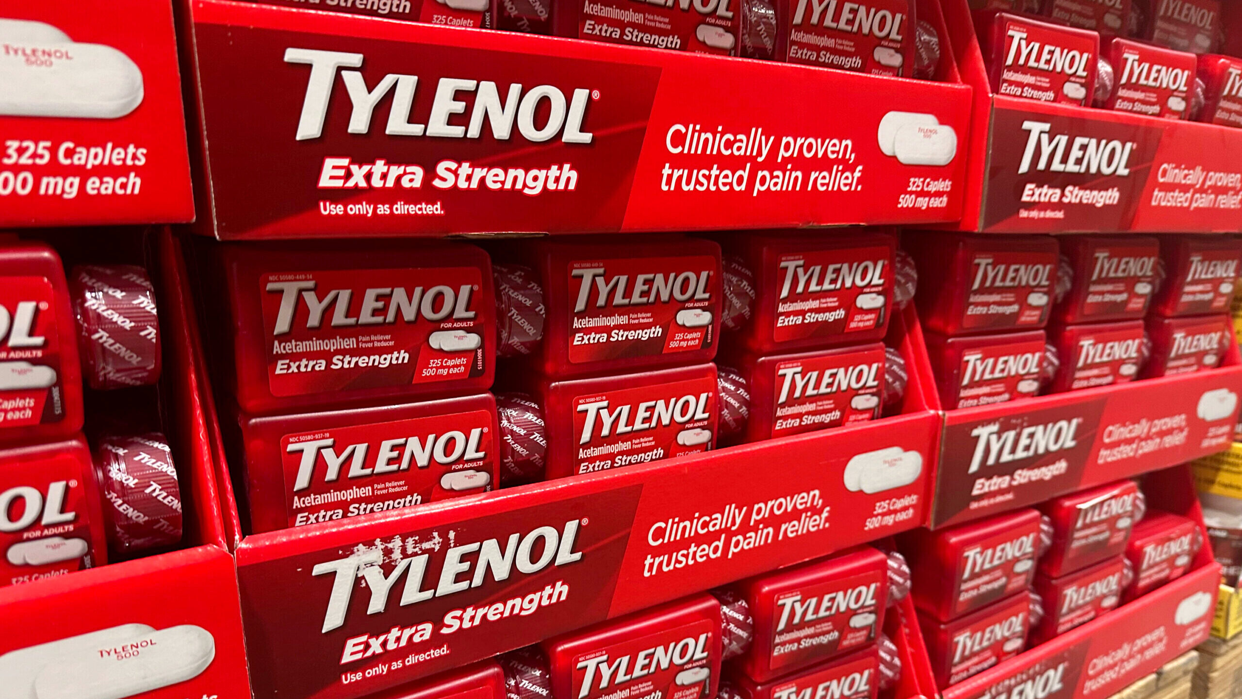 Photo of boxes of Tylenol on a store shelf.