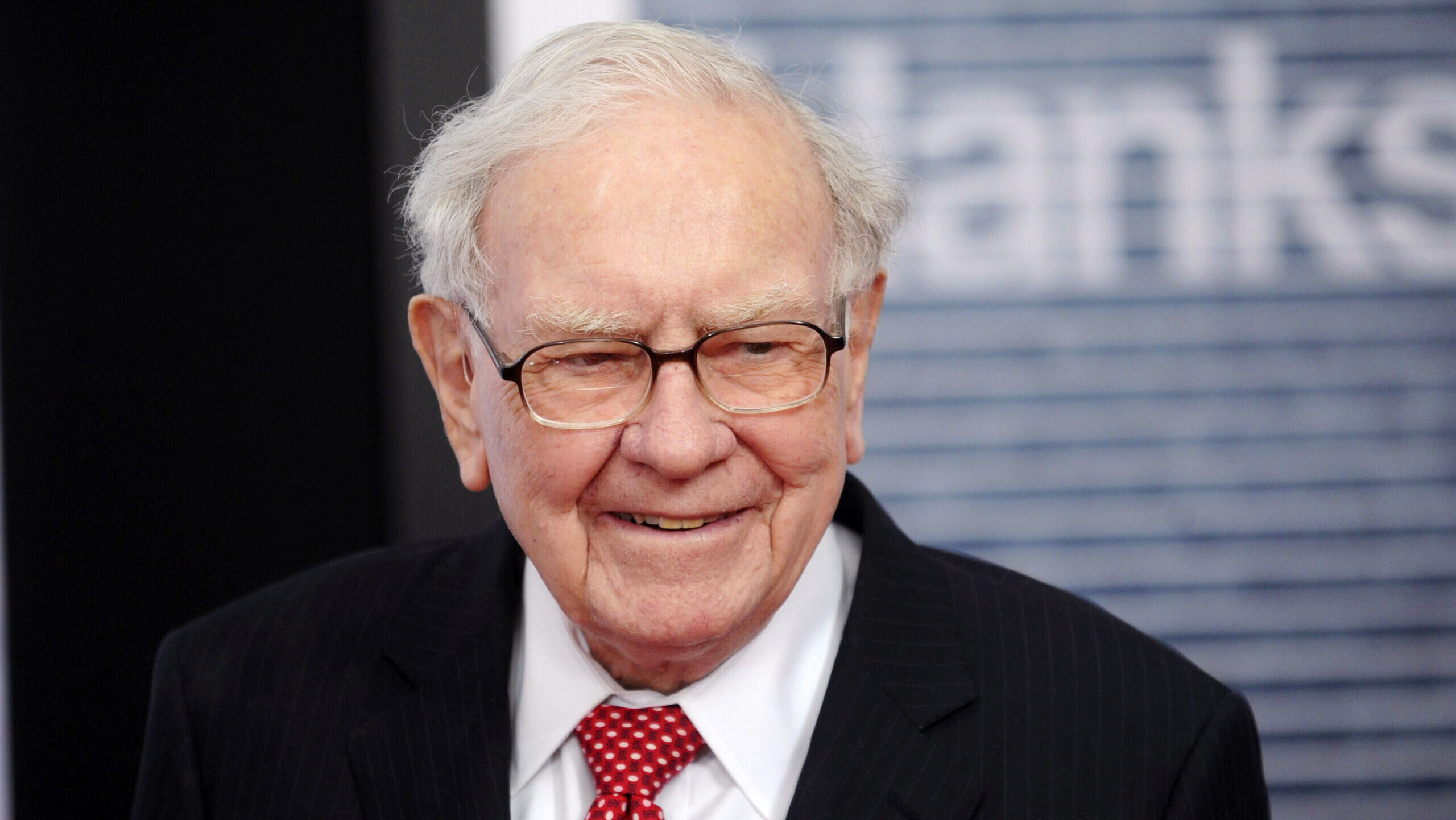 Warren Buffett is shown smiling outside of the former Newseum in Washington, D.C.