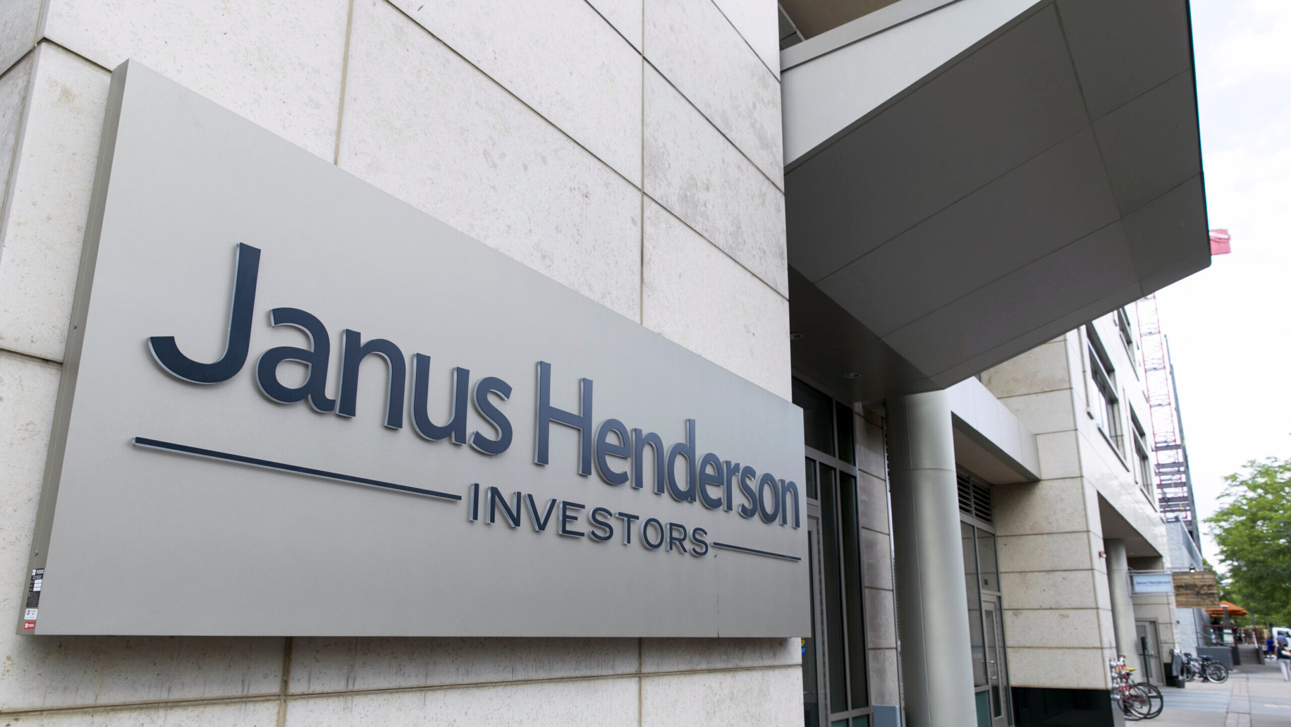 Photo of a Janus Henderson logo outside an office building.