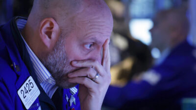 Wall Street Gets Squeezed by Twin Global Crises