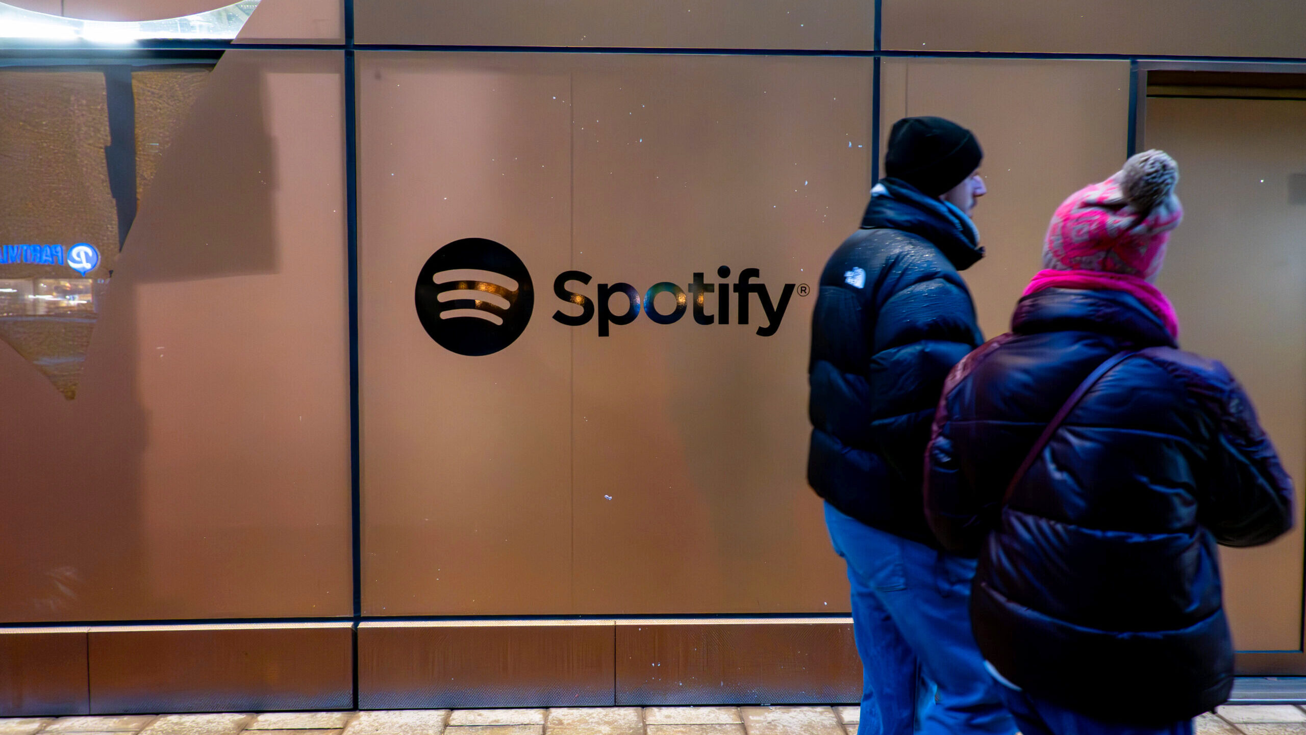 Photo of the Spotify logo outside a building.