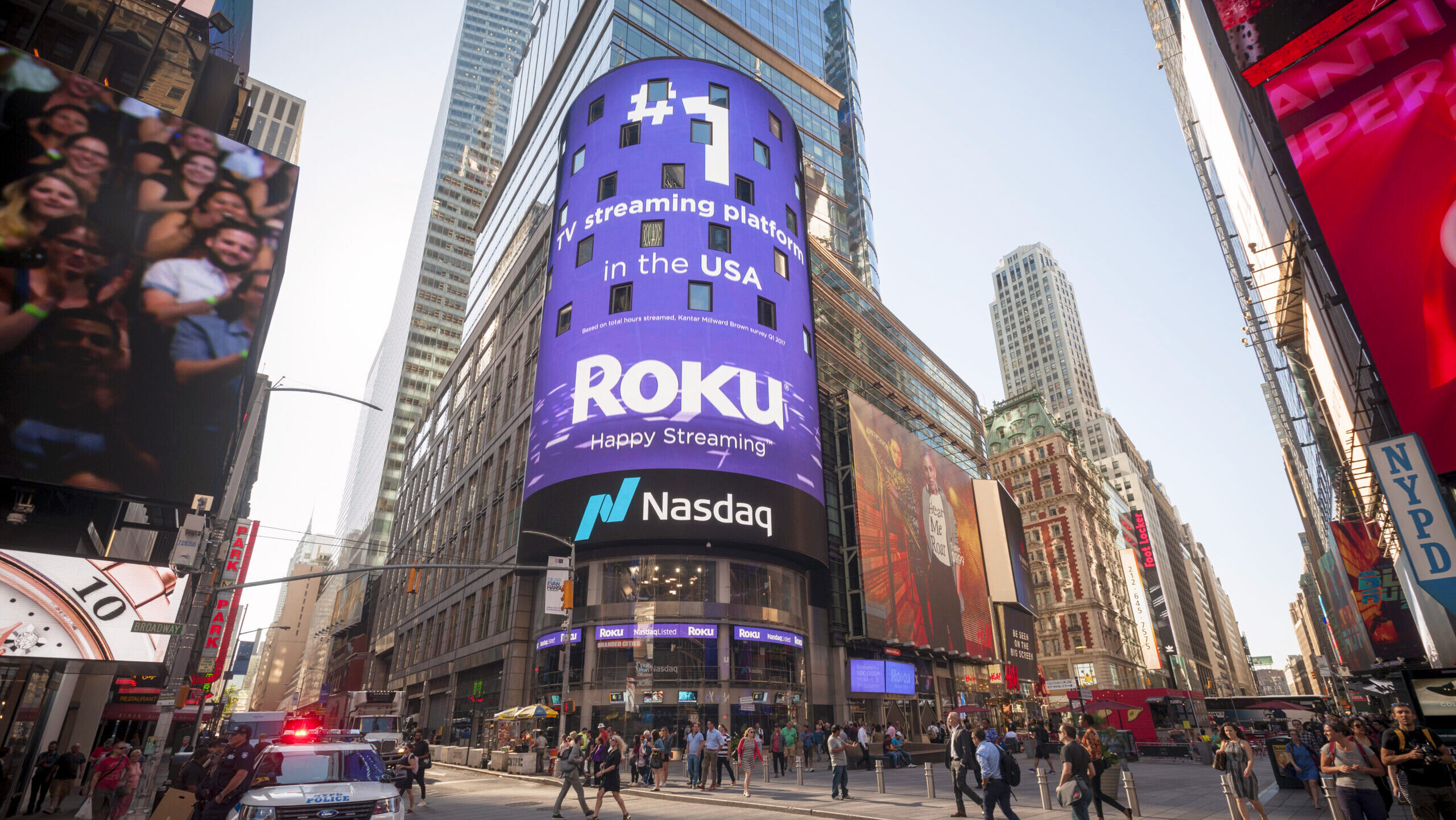 Photo of a Nasdaq logo on the video screen displays outside the Nasdaq exchange building.