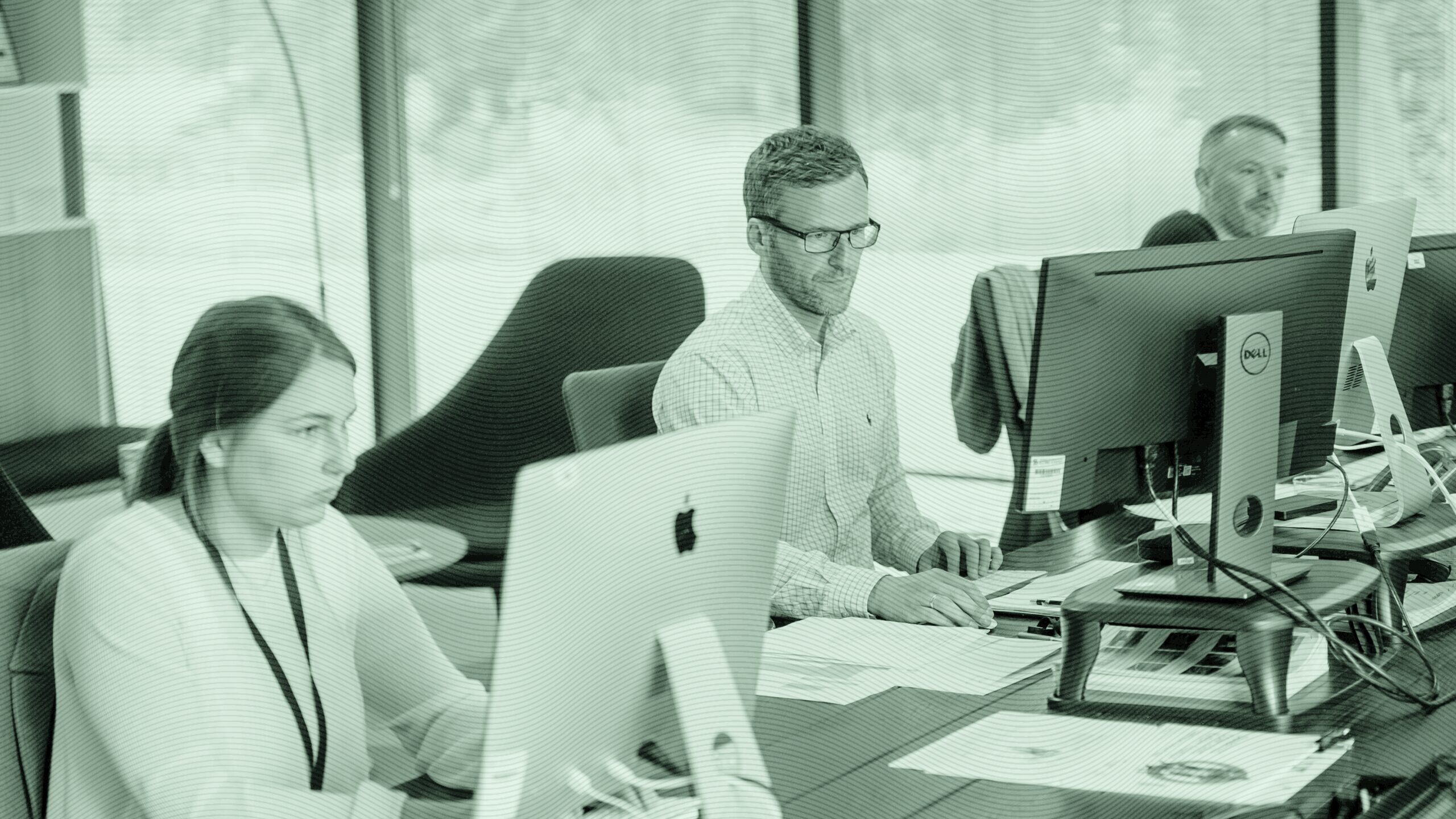 Officer workers at computers.