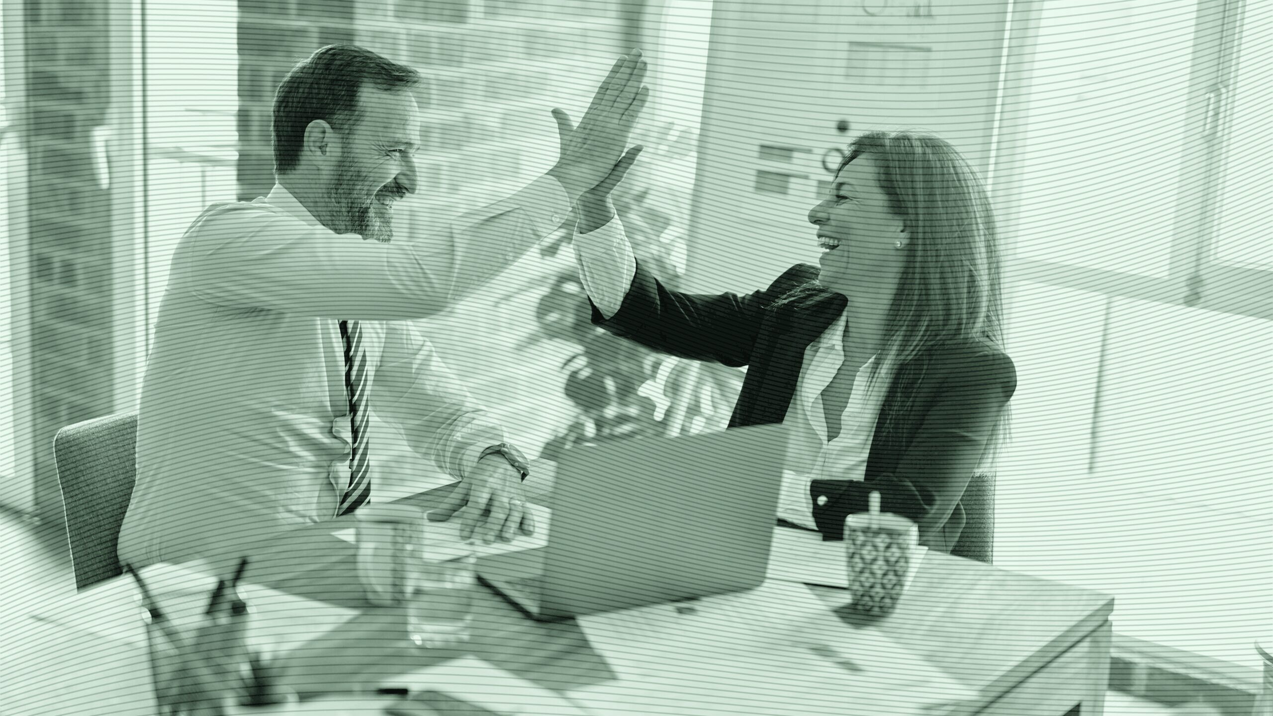 A man and woman high five.