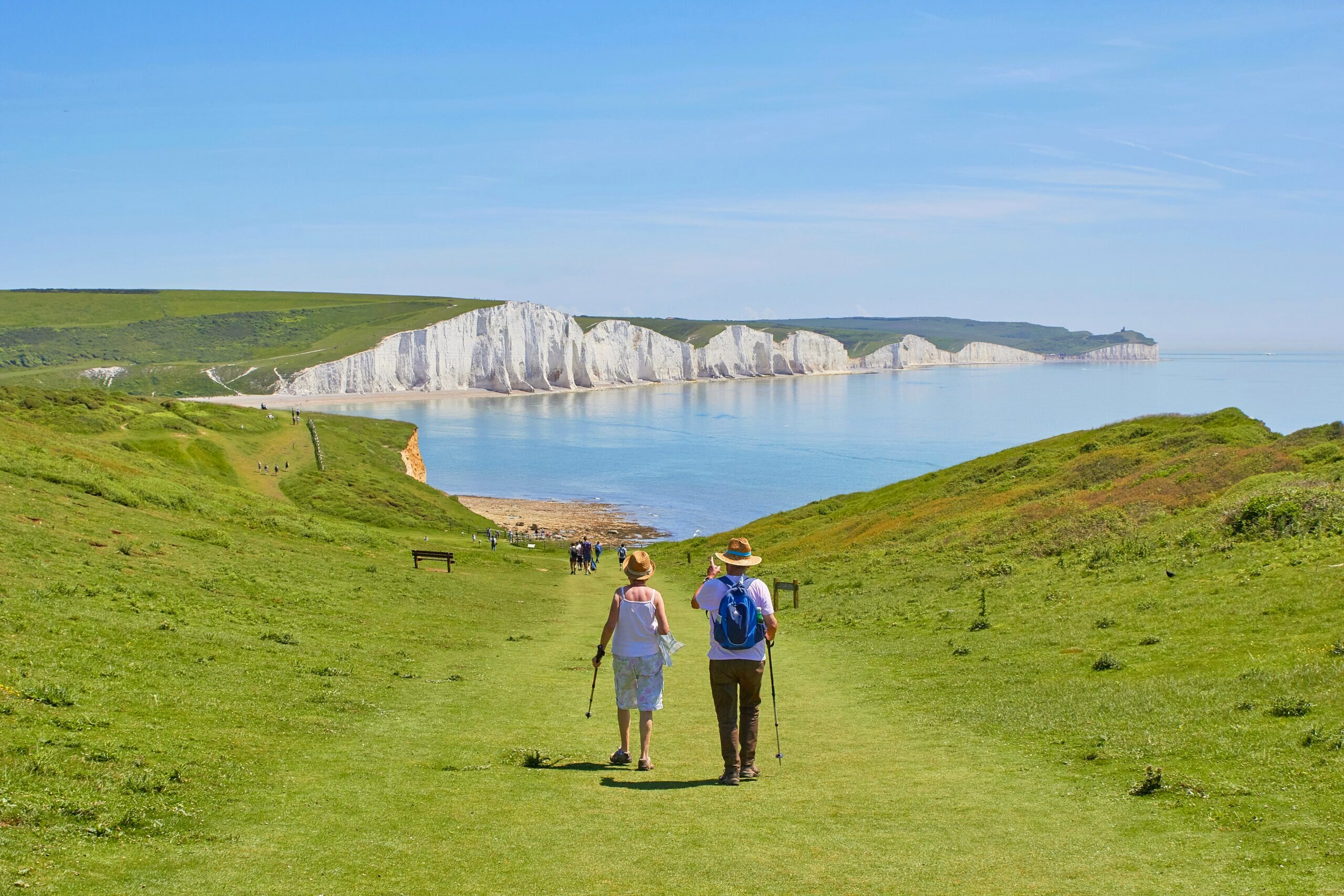 Couple walking along shoreline