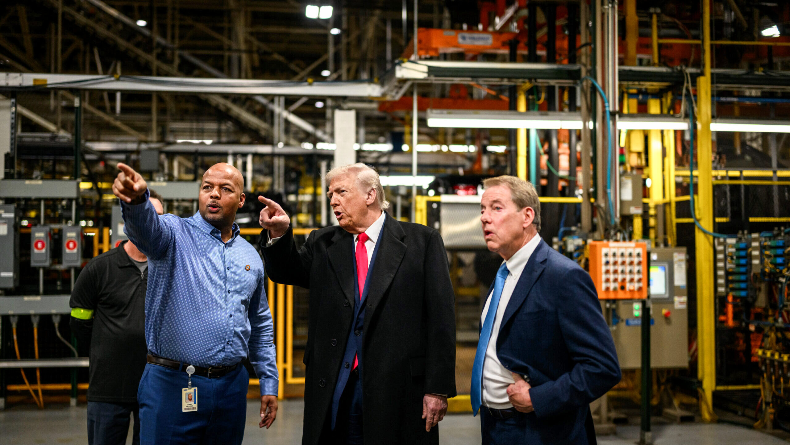 Photo of US President Donald Trump touring a Ford facility.