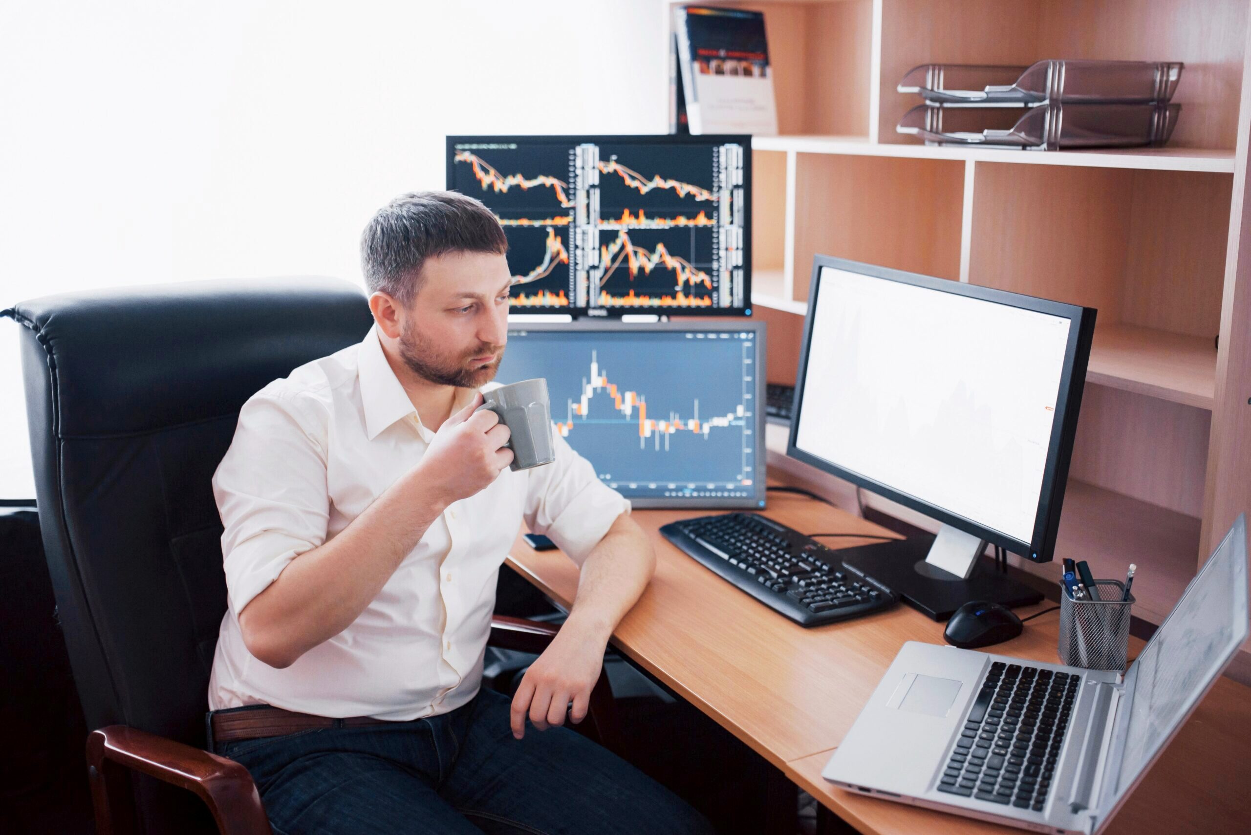 Trader at computers.
