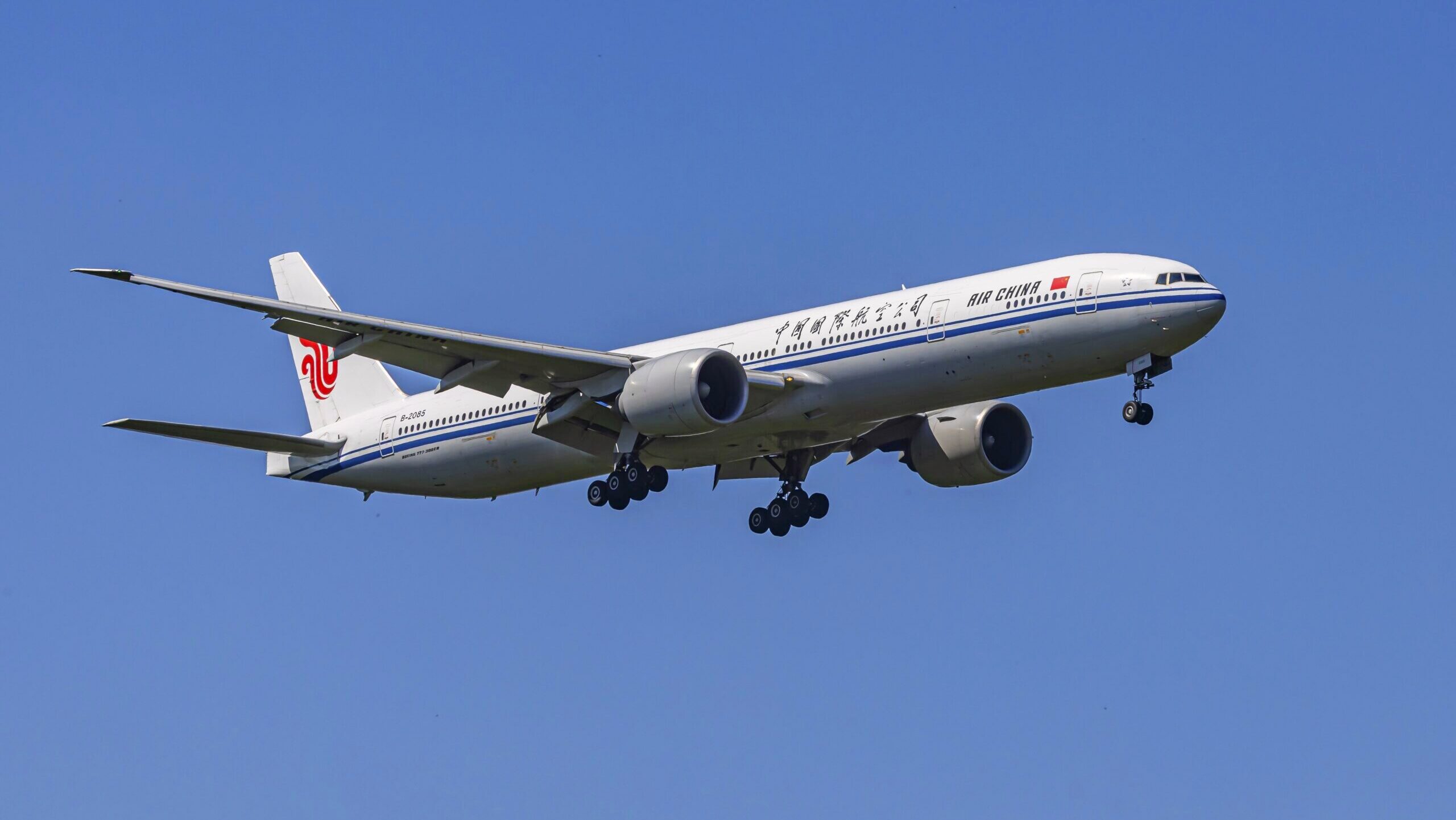 An Air China Boeing 777 aircraft approaches Frankfurt airport in preparation for landing.