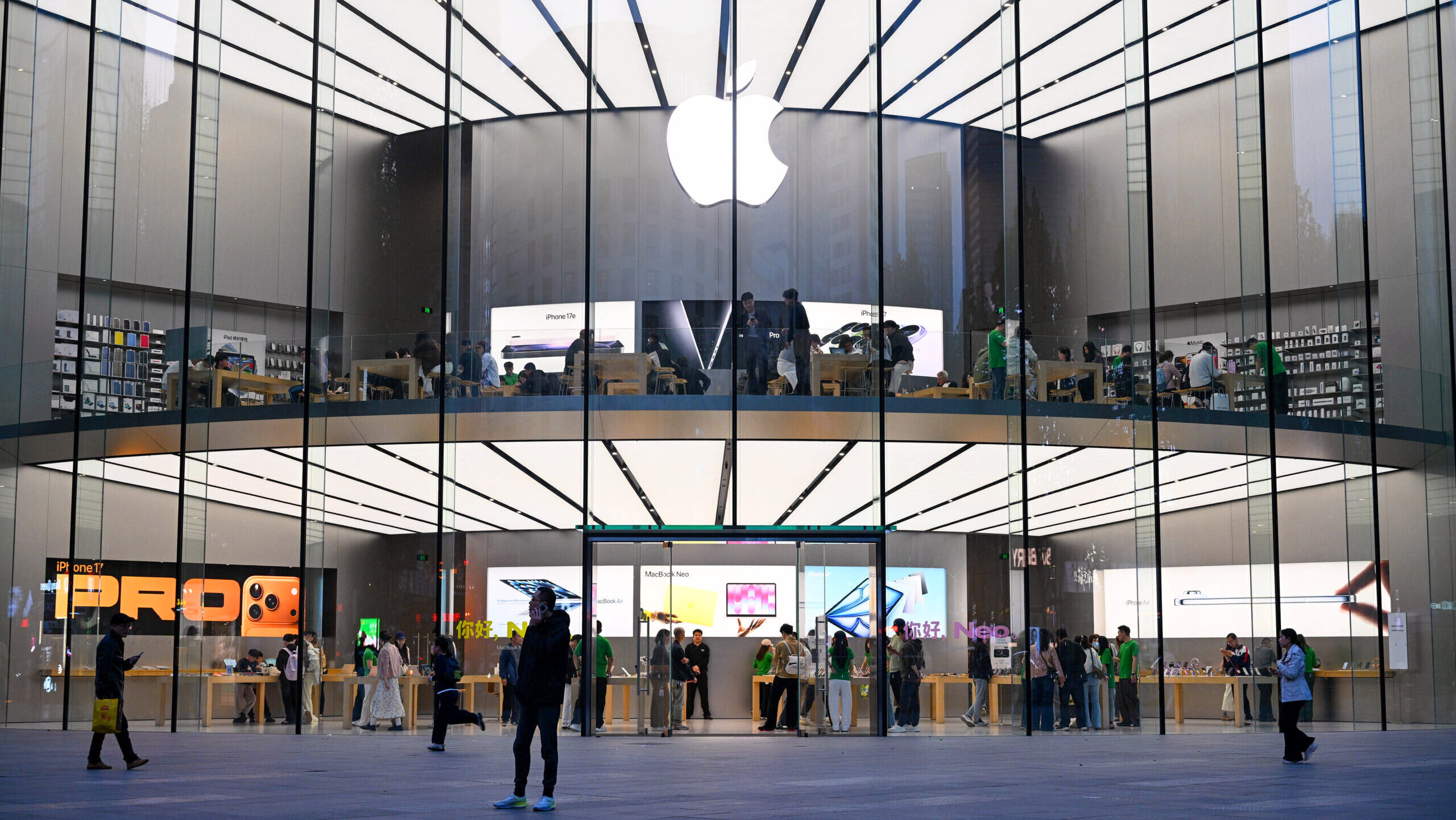 Customers are shown at an Apple store in Nanjing, China.